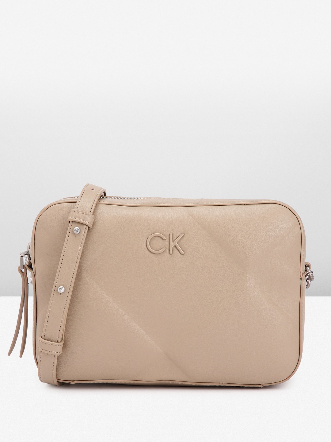 

Calvin Klein Geometric Design Structured Sling Bag with Quilted Detail, Taupe