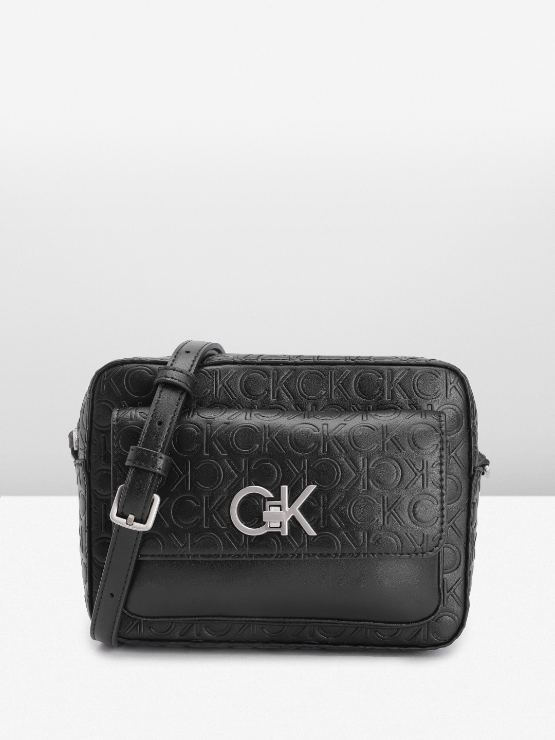 

Calvin Klein Brand Logo Textured Structured Sling Bag, Black