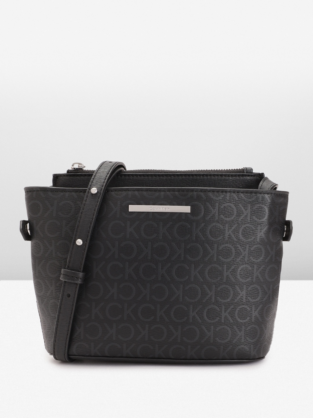 

Calvin Klein Brand Logo Print PU Structured Sling Bag, Black