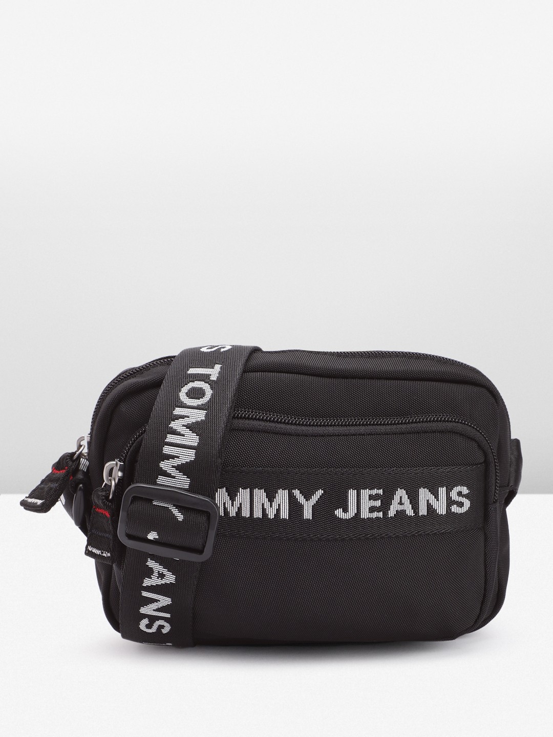 

Tommy Hilfiger Solid Structured Sling Bag with Brand Logo Applique, Black