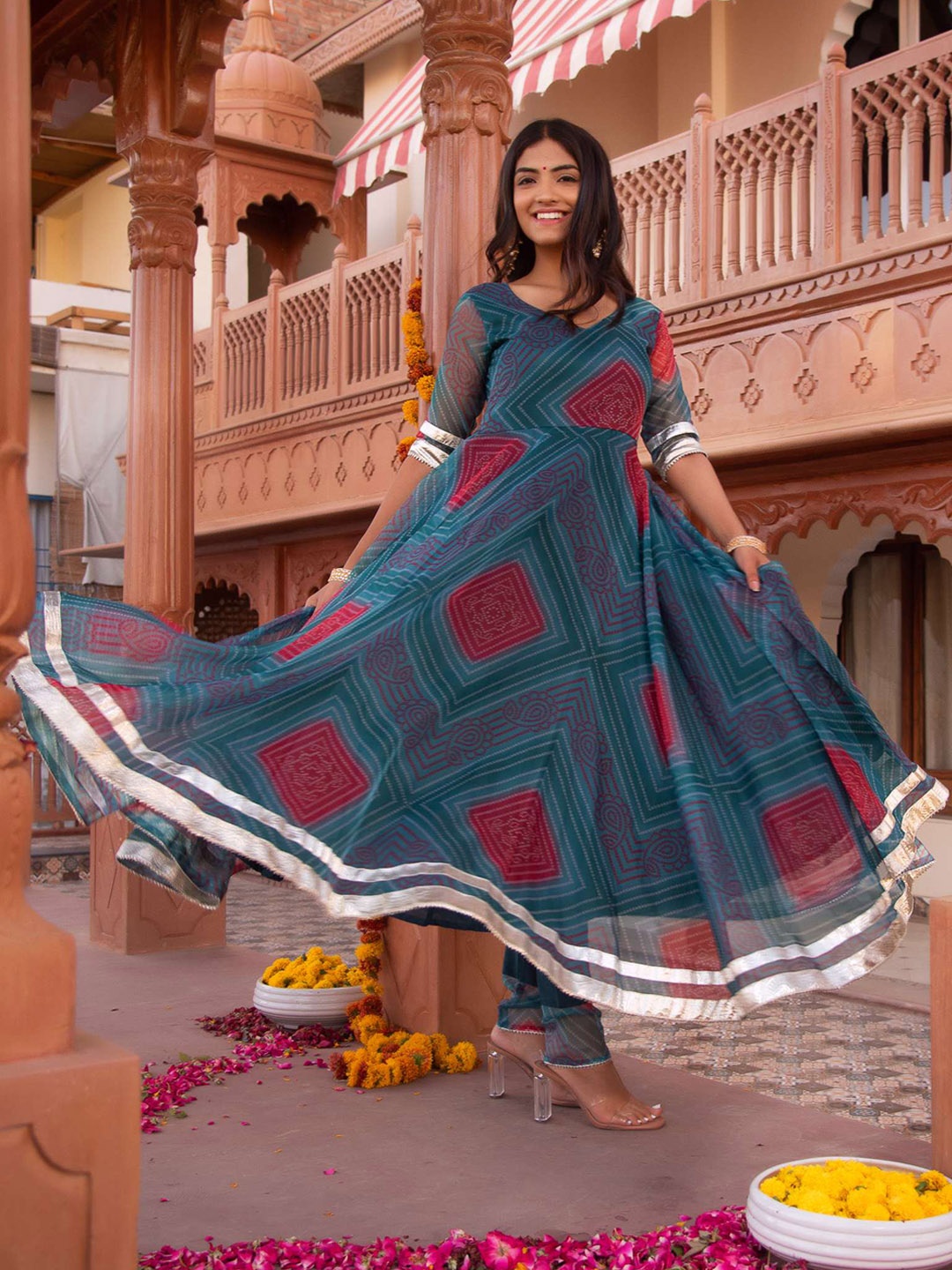 

Calmna Women Bandhani Printed Empire Gotta Patti Kurta with Trousers & With Dupatta, Turquoise blue