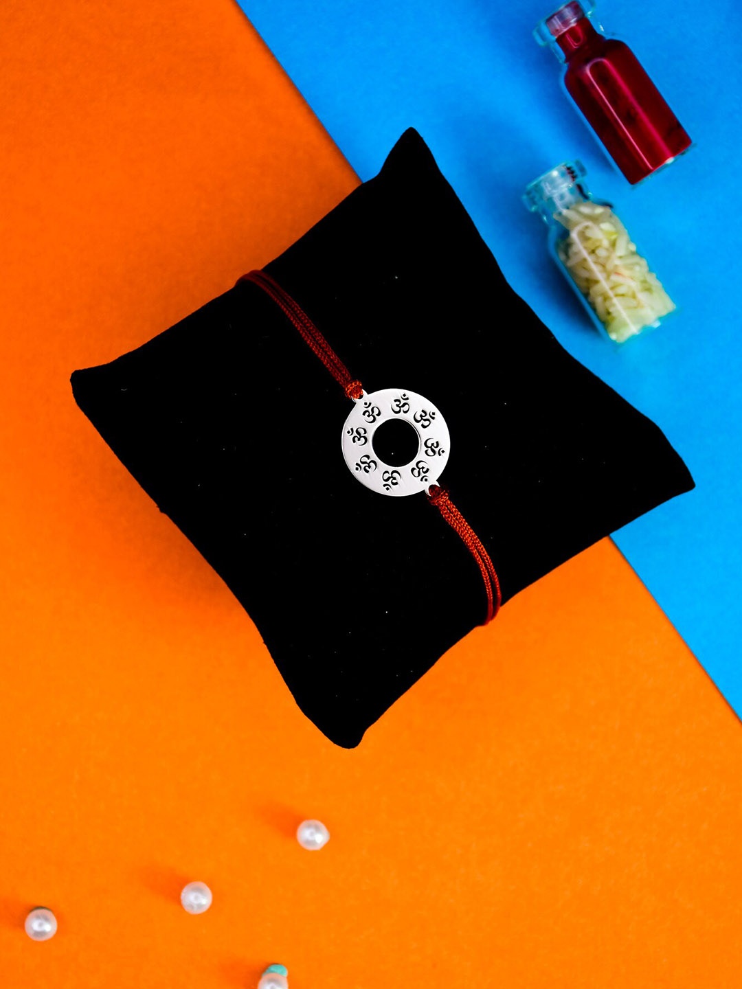 

Arte Jewels 925 Silver OM Rakhi With Roli & Rice