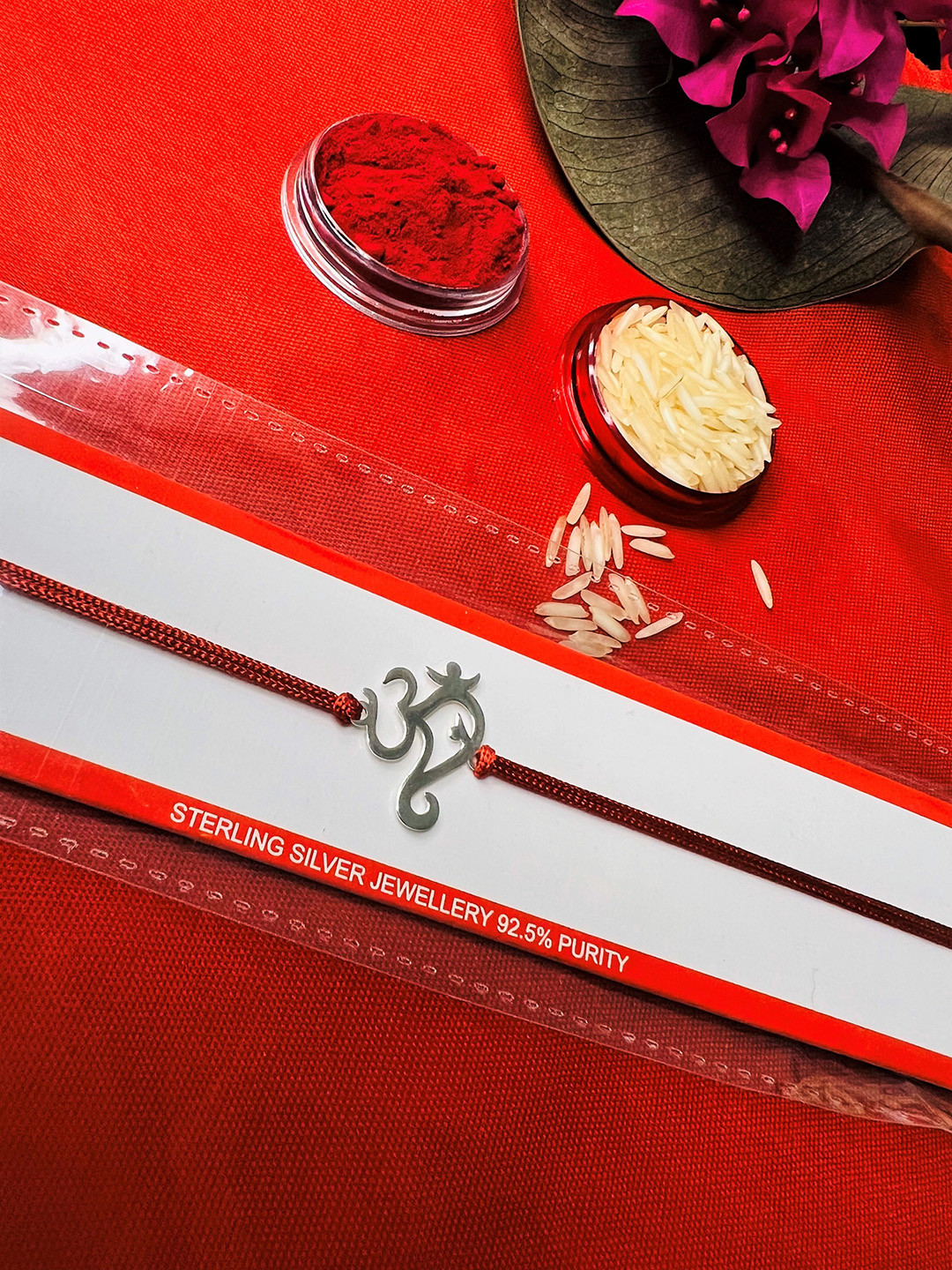 

Arte Jewels 925 Silver OM Rakhi With Roli & Rice