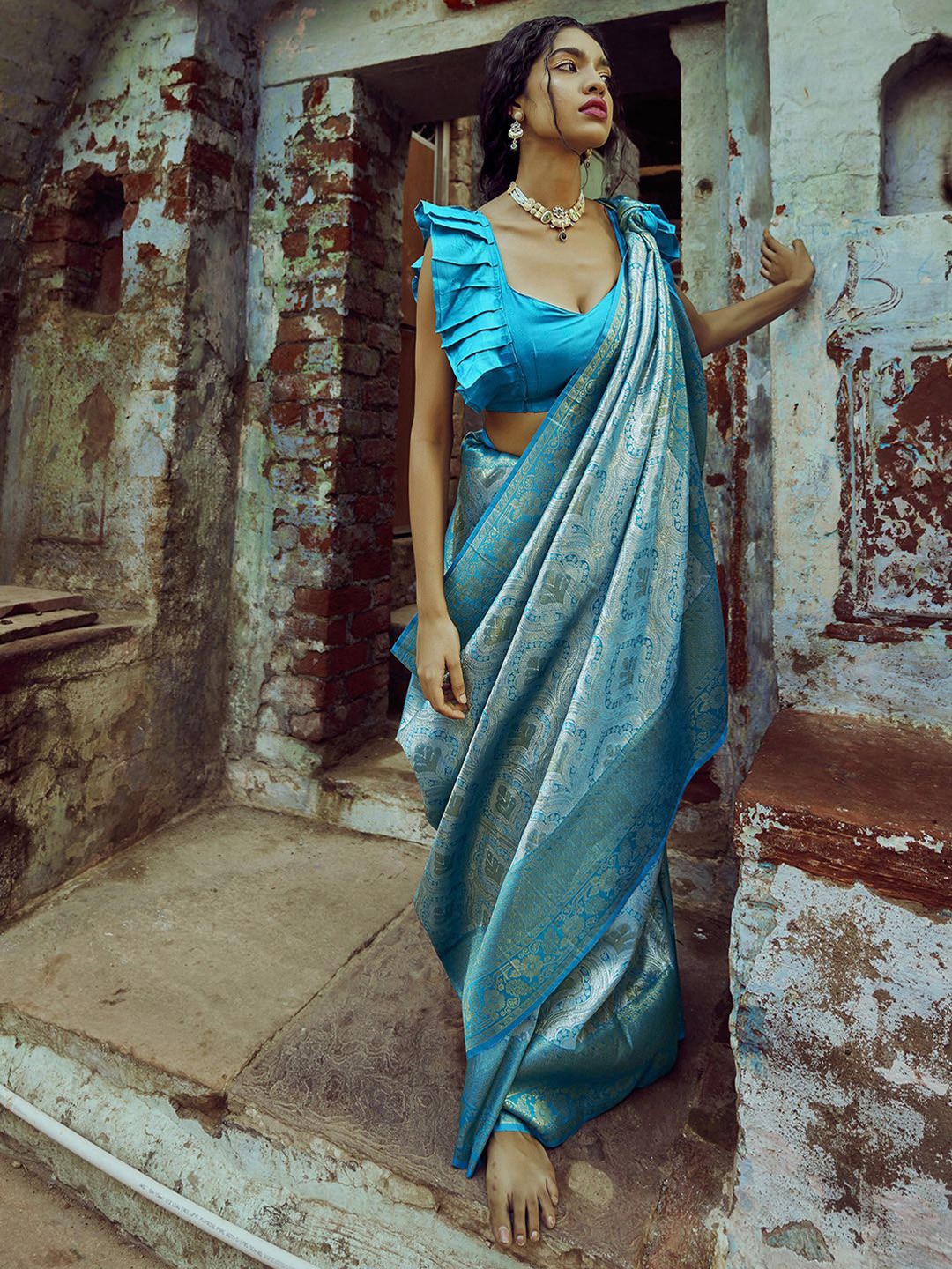 

Mitera Teal & Silver-Toned Ethnic Motifs Woven Design Kanjeevaram Saree
