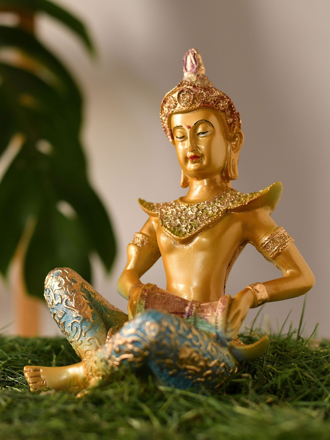 

Fashion Bizz Gold-Toned & Blue Dholak Buddha Showpiece