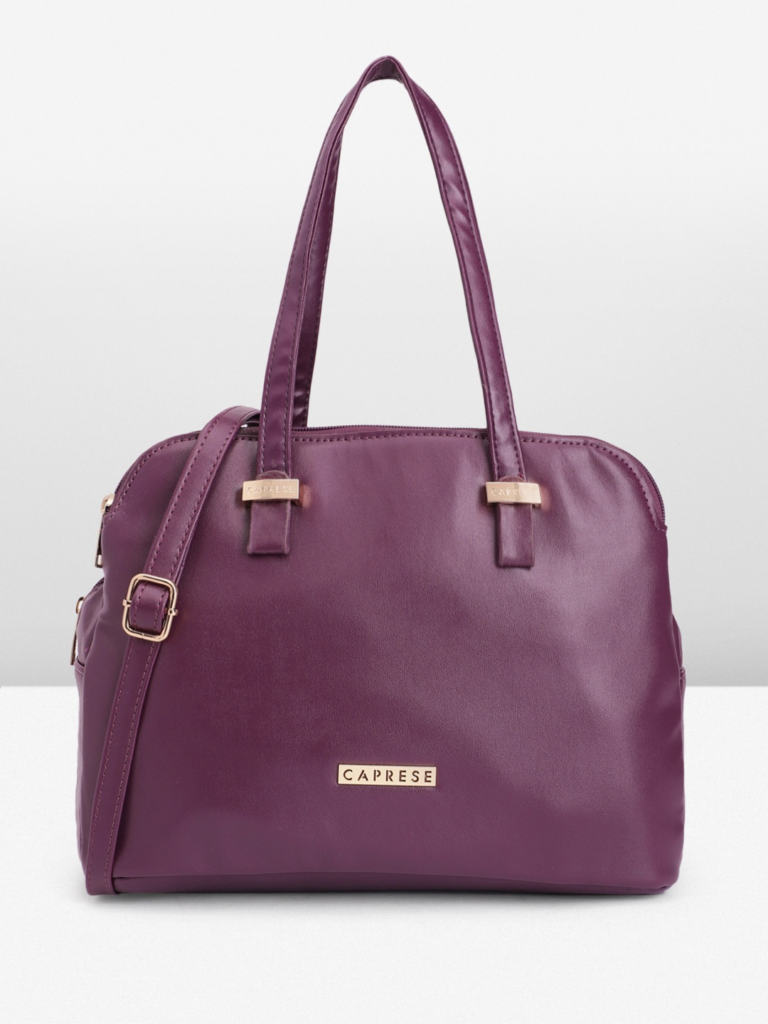 

Caprese Women Solid Handheld Bag, Purple