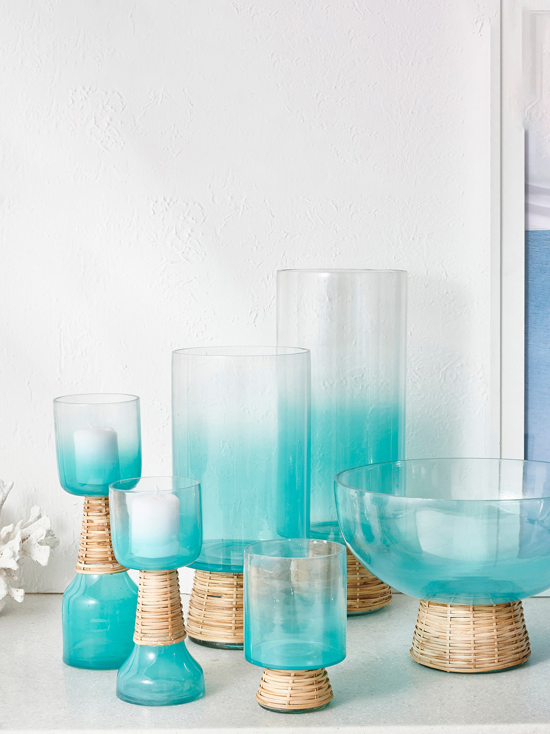 

Home Centre Splendid Santorini Teal Blue & Transparent Glass & Rattan Candle Holder