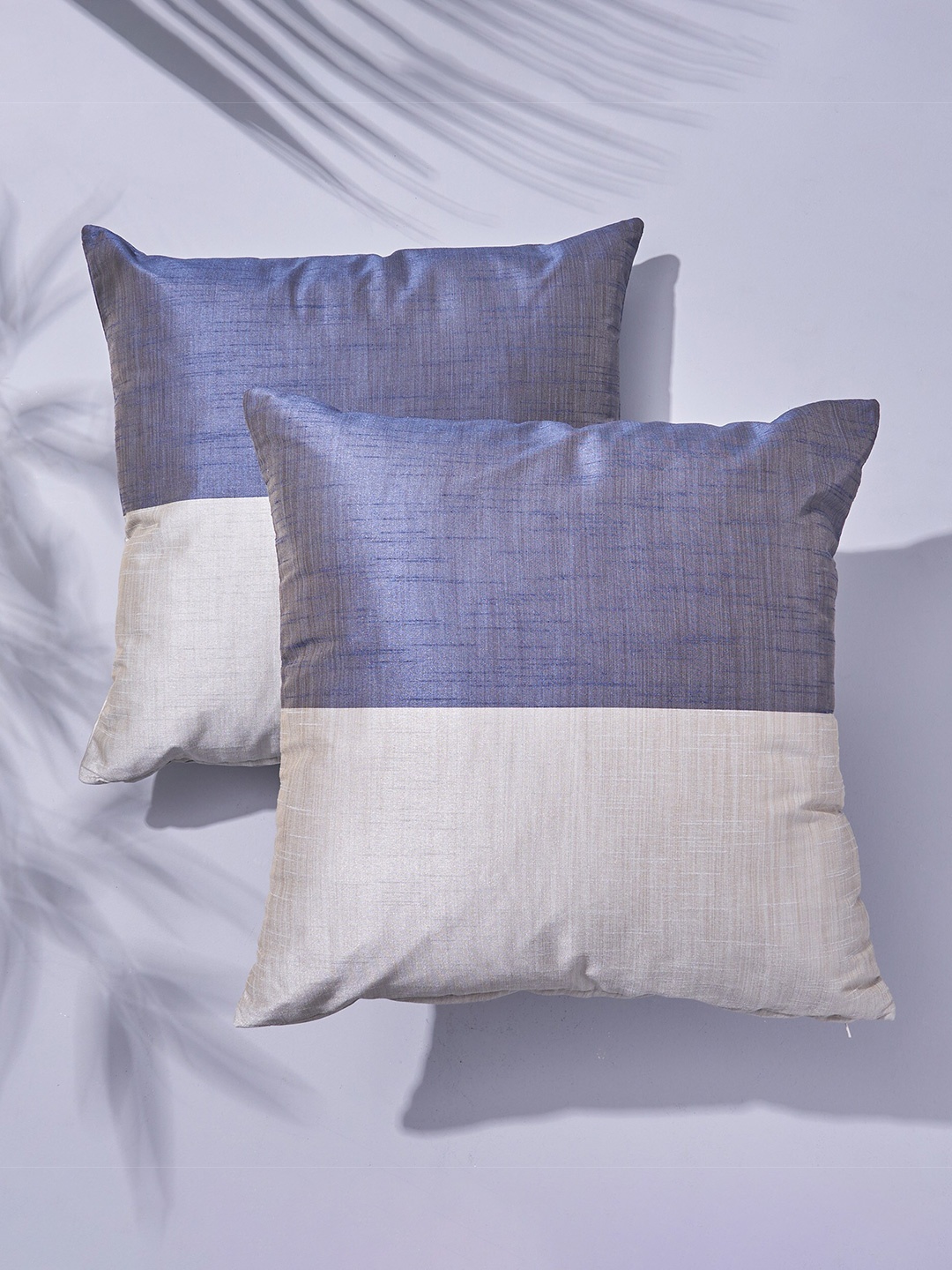 

Home Centre Wesley Grey & White 2-Pieces Colourblocked Square Cushion Covers