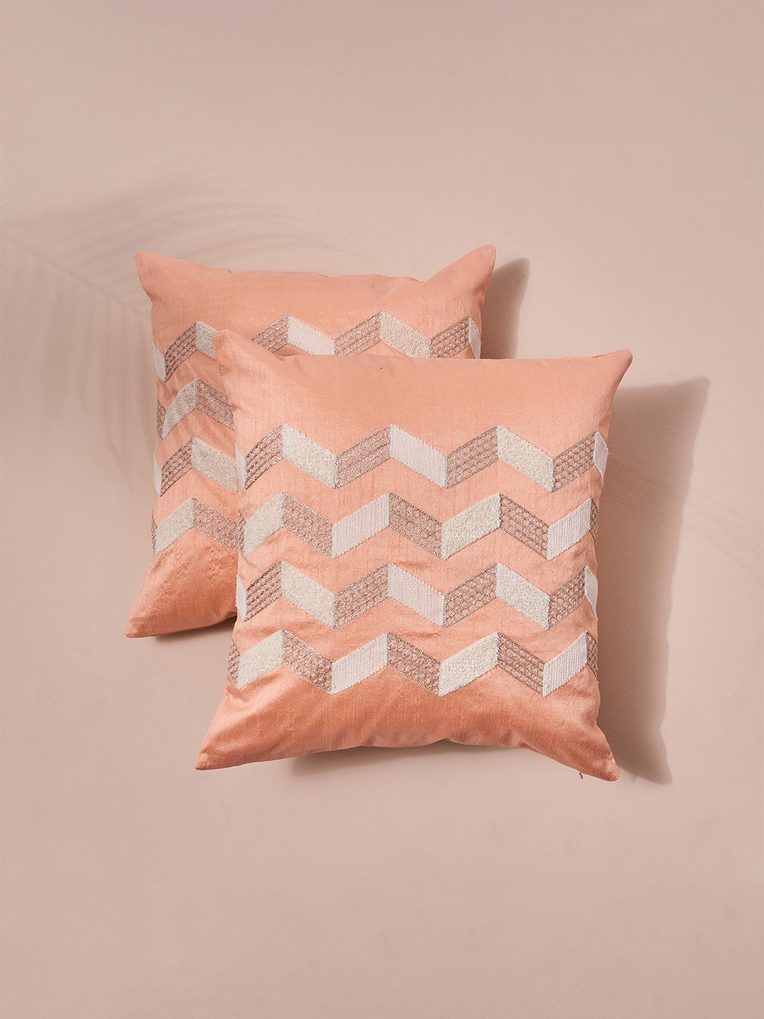 

Home Centre Adam Peach-Coloured & White 2 Pieces Geometric Square Cushion Covers