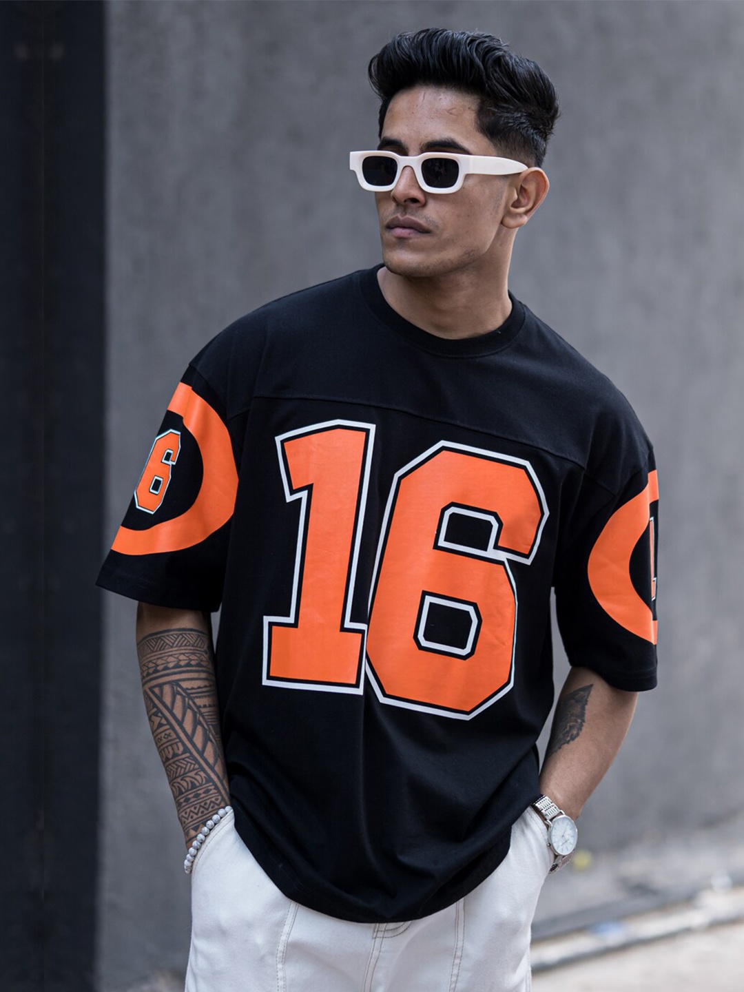 

Powerlook Black Varsity Printed Drop-Shoulder Sleeves Cotton Oversized T-Shirt
