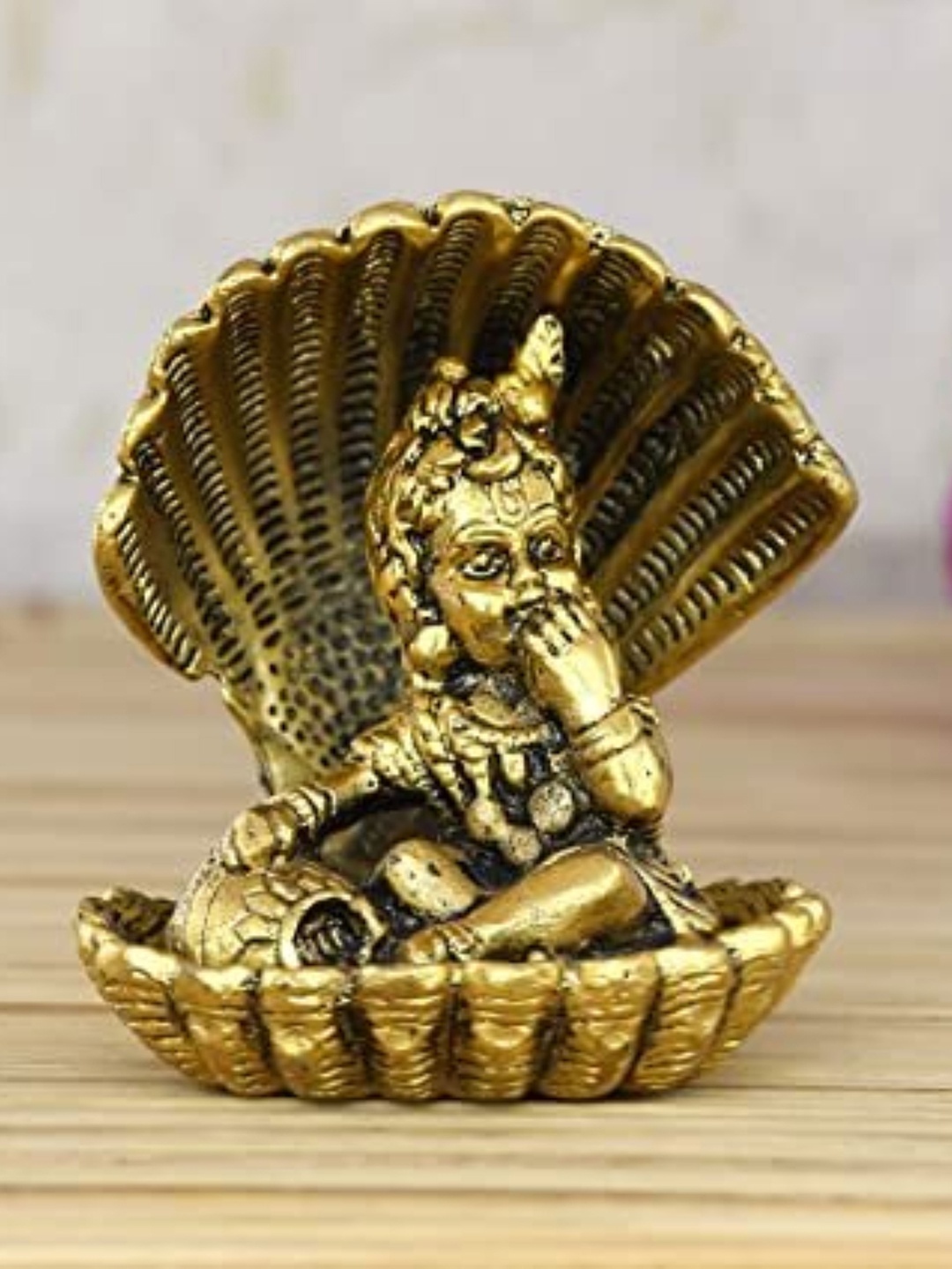 

Fashion Bizz Gold-Toned Sheshnaag Krishna Religious Showpiece