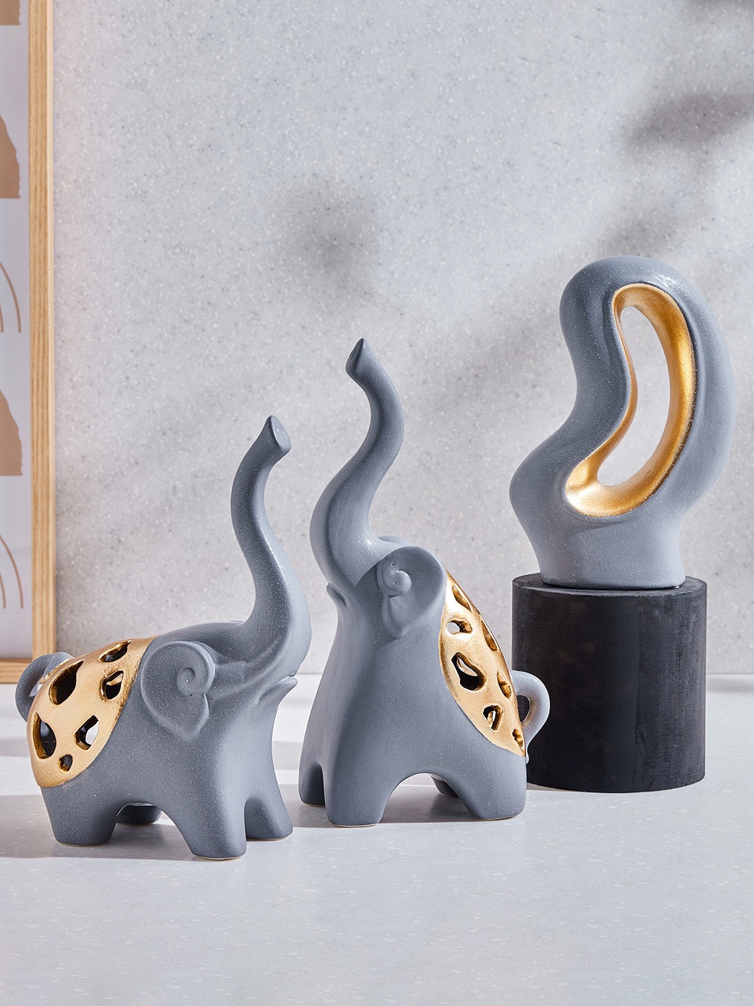 

Home Centre Marshmallow Grey & Gold Toned Elephant Figurine Showpiece
