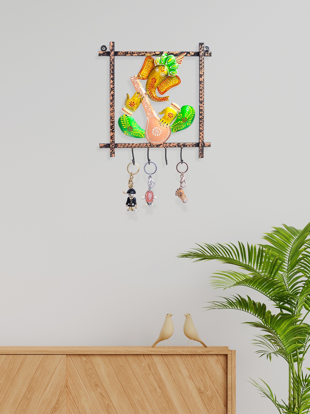 

Golden Peacock Black & Green Ganesha Shaped Keyholder