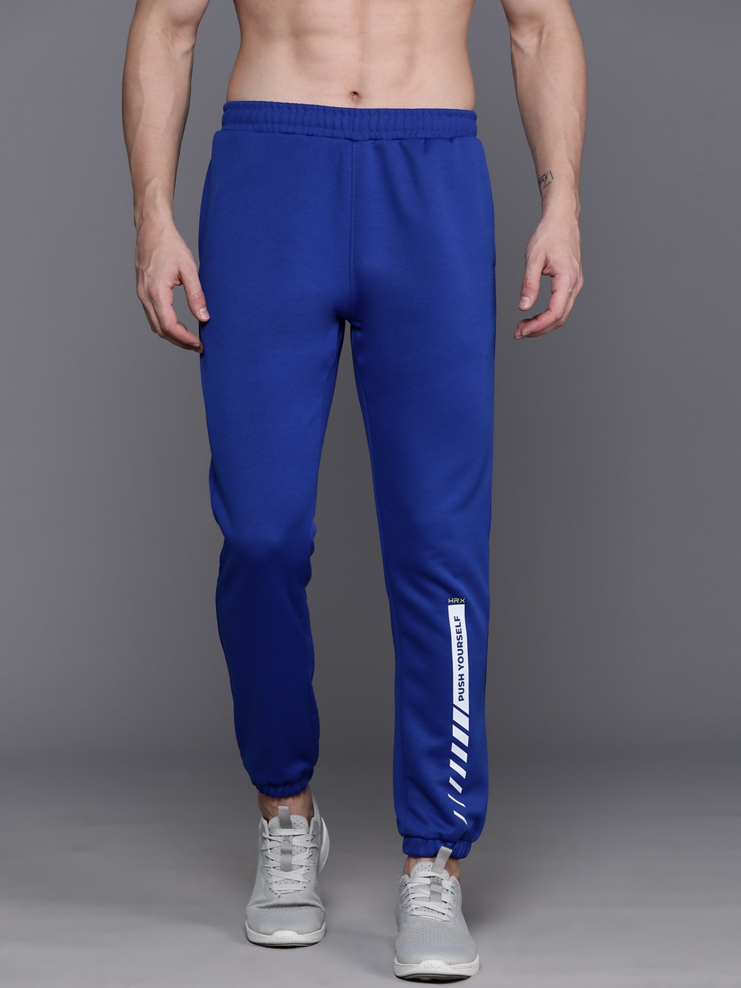 

HRX by Hrithik Roshan Men Rapid-Dry Typography Training Joggers With Reflective Elements, Blue