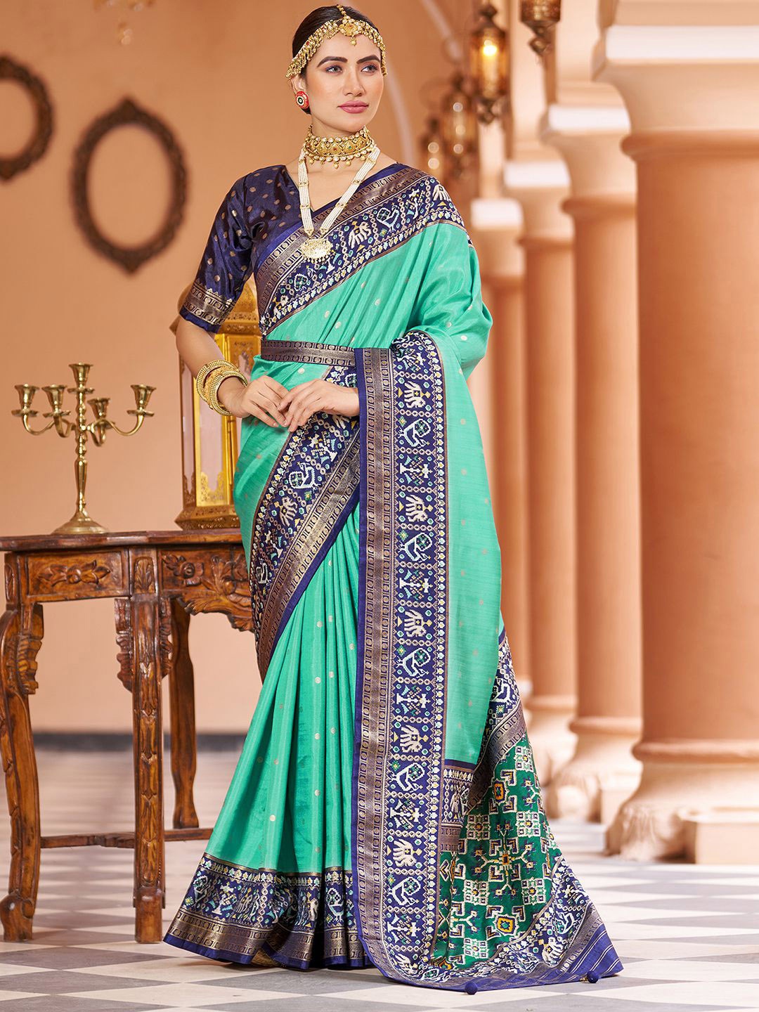 

Mitera Green & Blue Ethnic Motifs Printed Zari Saree
