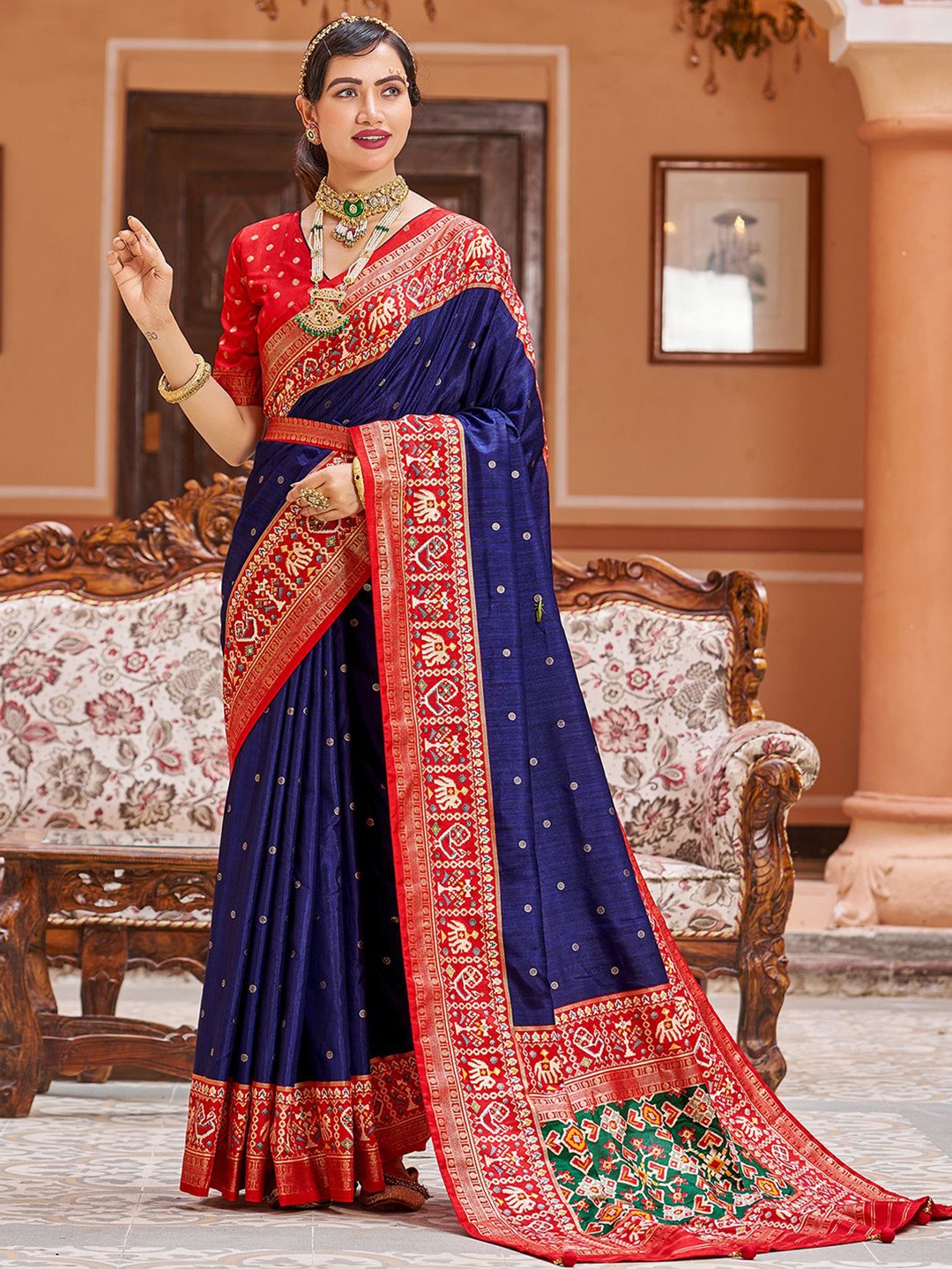 

Mitera Blue & Red Ethnic Motifs Printed Zari Saree