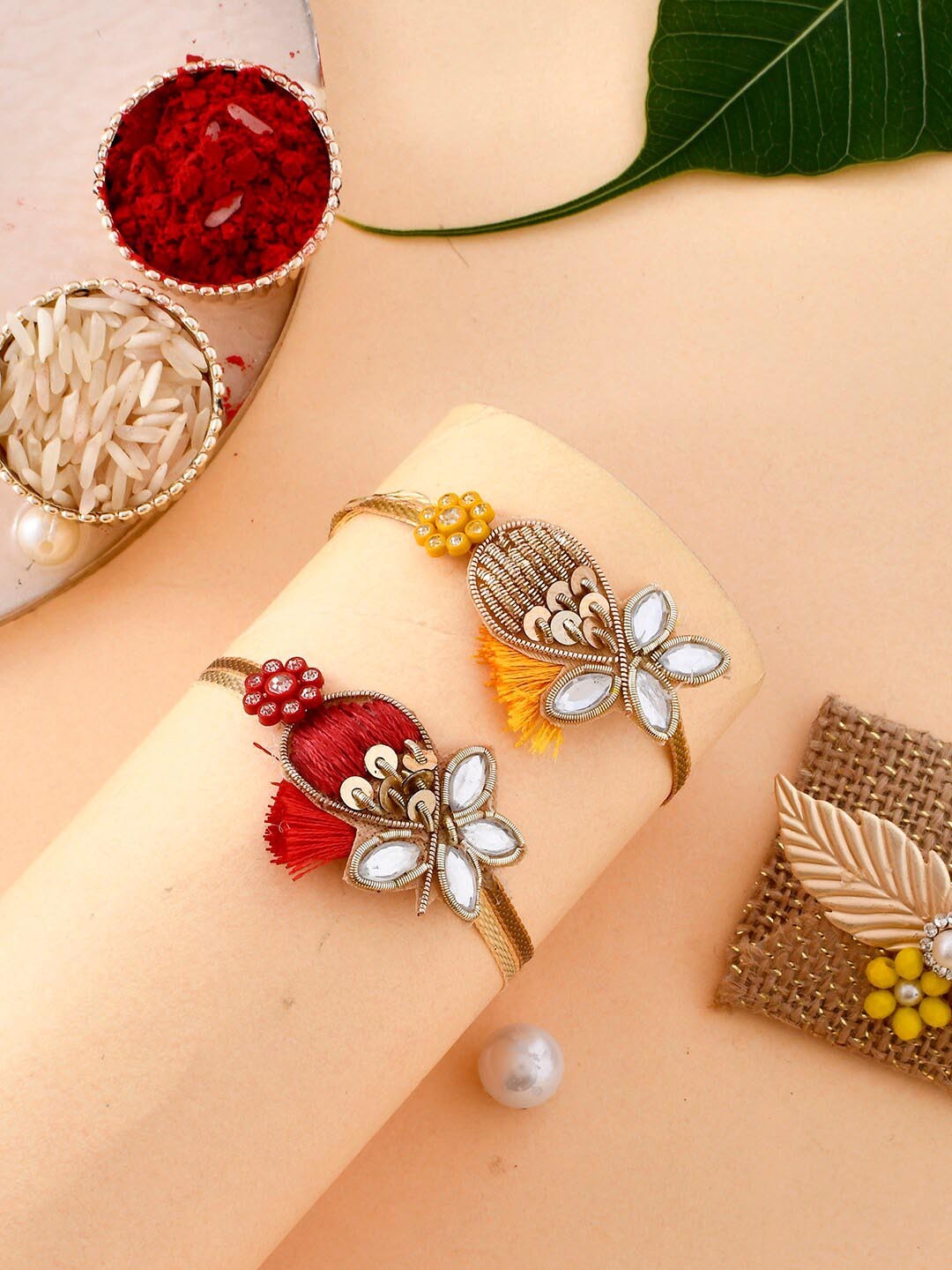 

Aapno Rajasthan Set Of 2 Embellished Kundan Sparkling Resham Rakhi Set, Gold