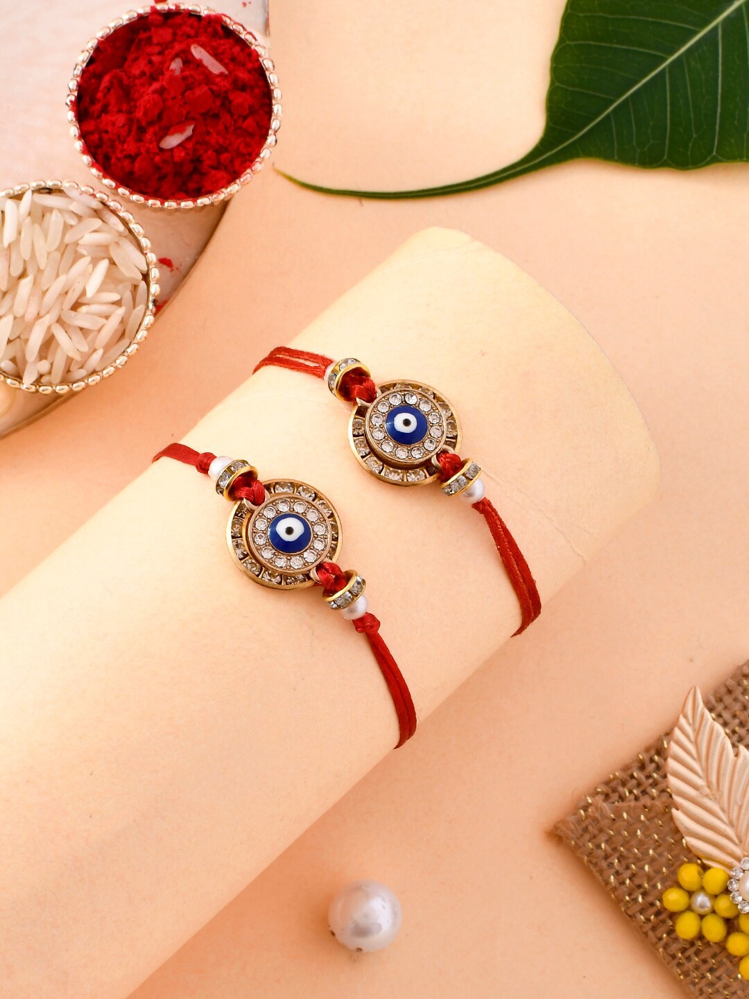 

Aapno Rajasthan Set Of 2 Evil Eye Woven Elegant Rakhi Set, Red