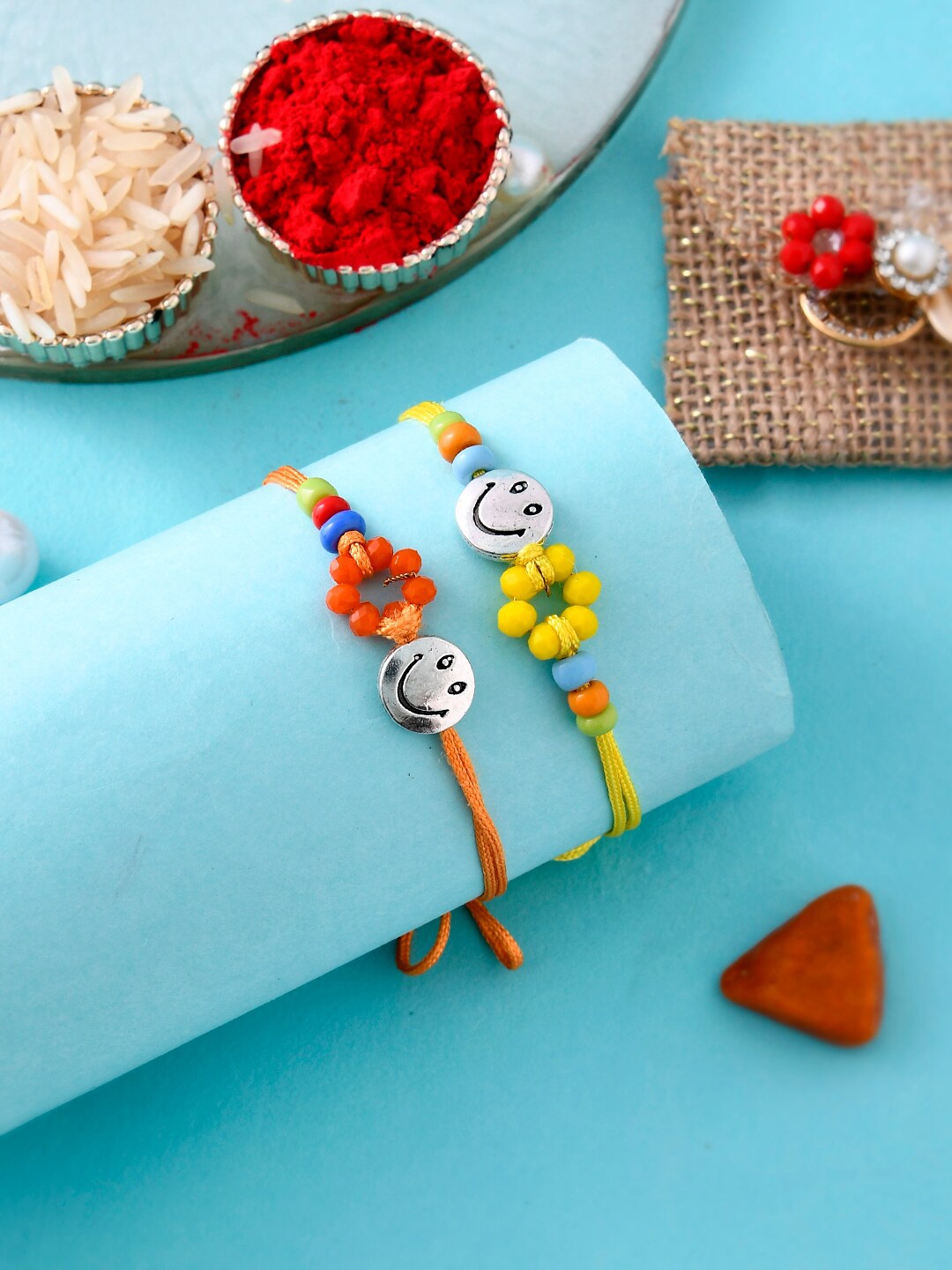 

Aapno Rajasthan Set Of 2 Silver Smiley with Woven Beads Rakhi, Yellow
