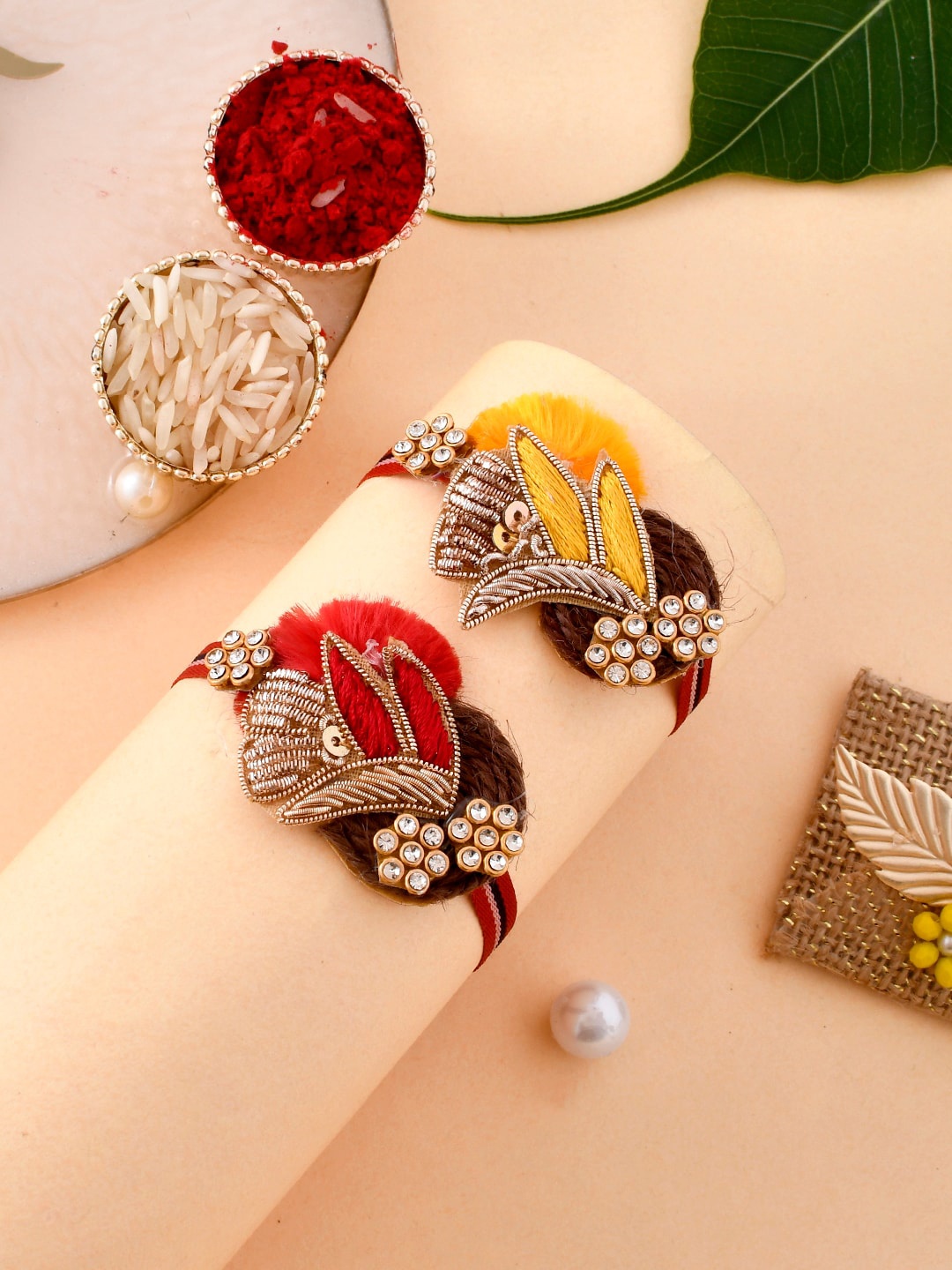 

Aapno Rajasthan Set Of 2 Zari Design Resham Rakhi With Roli Rice & Greeting Card, Red