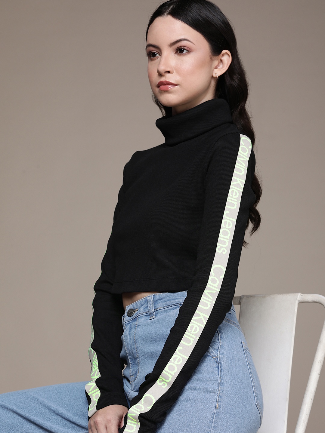 

Calvin Klein Jeans Brand Logo Printed Ribbed High Neck Crop Top, Black