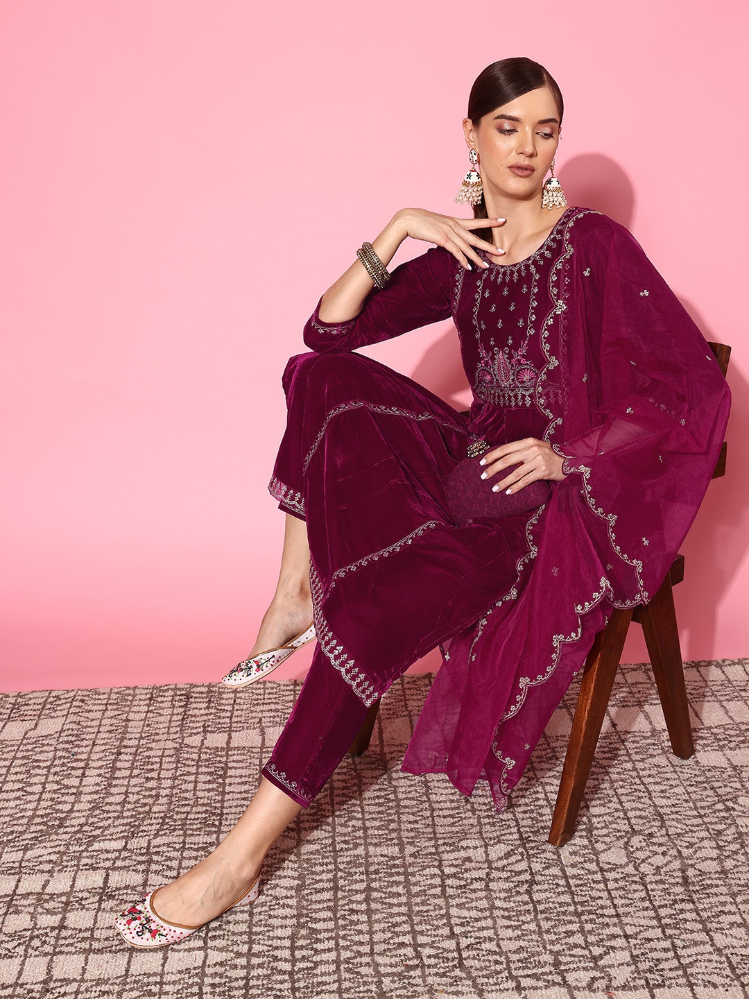 

Sangria Ethnic Motifs Embroidered Panelled Thread Work Velvet Kurta Set, Magenta
