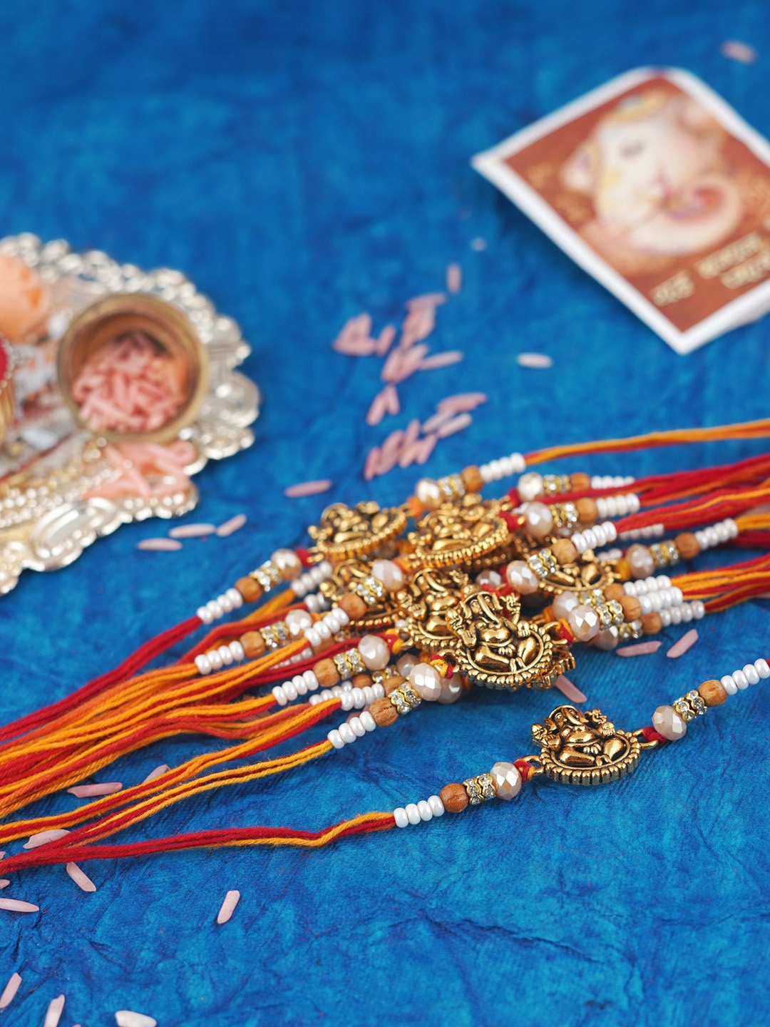 

MANSIYAORANGE Set Of 12 Gold-Plated Elegant Ganesha Charm Tie-Up Rakhis