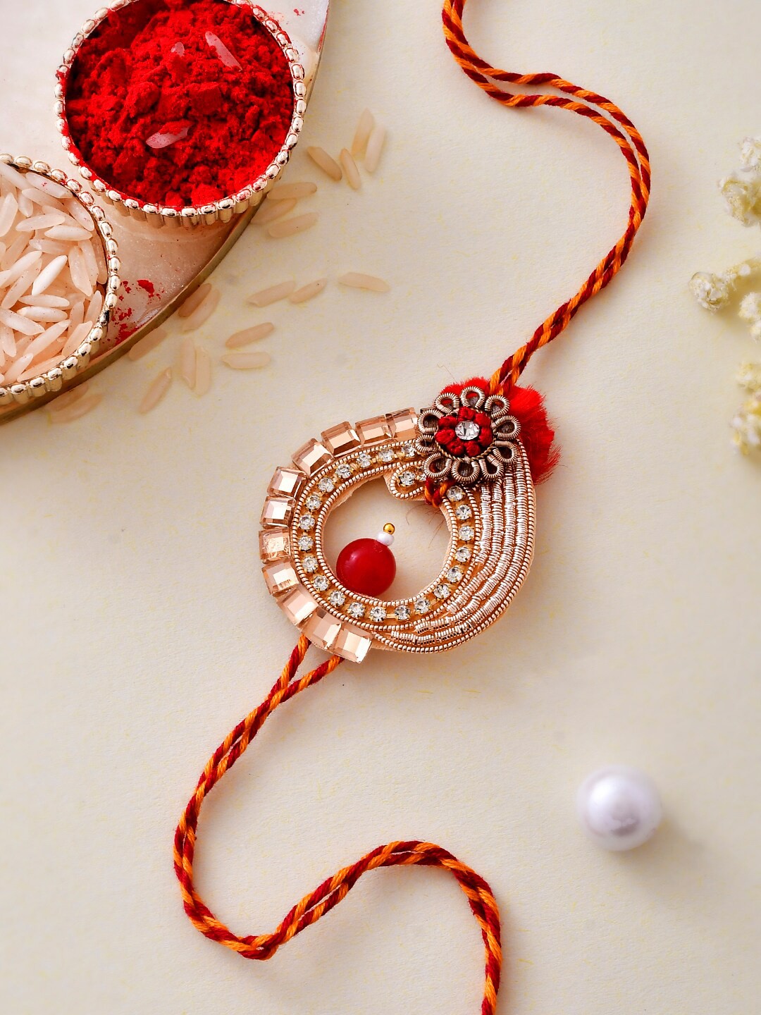 

Aapno Rajasthan Gold-Plated Kundan and Beads Embellished Royal Rakhi