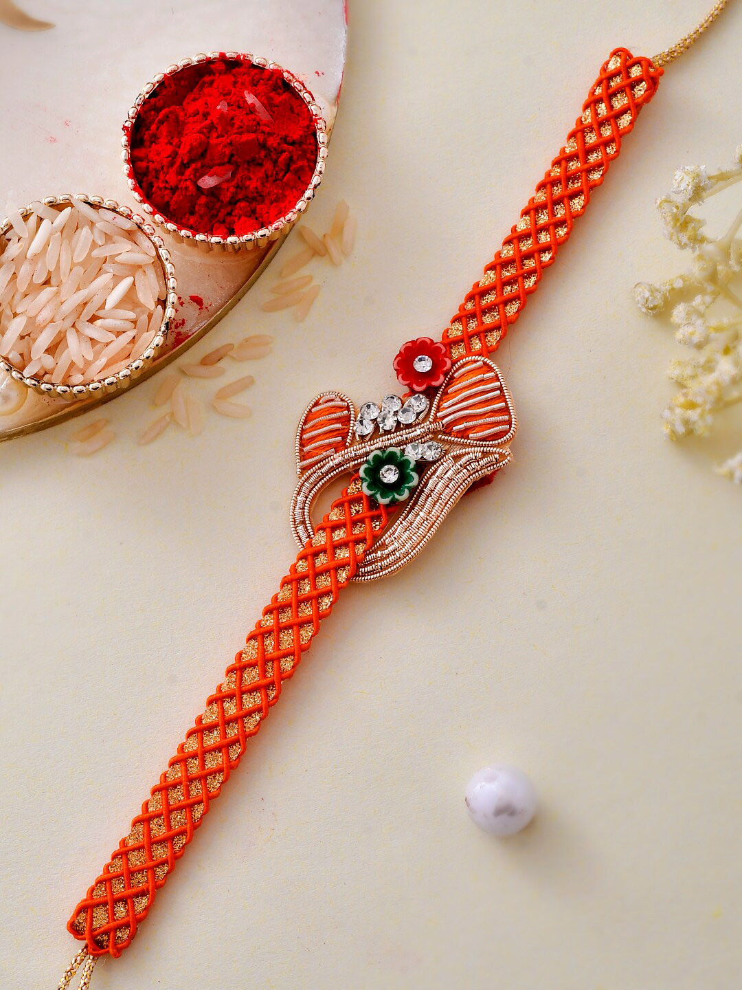 

Aapno Rajasthan Craftedjaali Patterned Rakhi, Orange