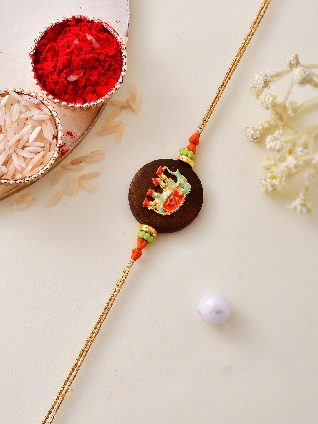 

Aapno Rajasthan Resin Elephant Embossed Royal Rakhi, Brown