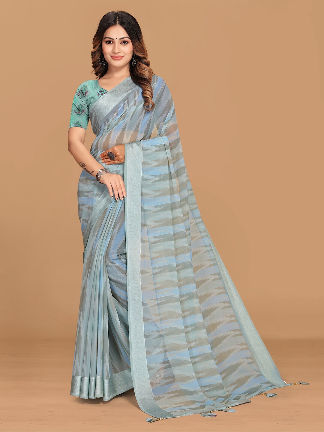 

Triveni Abstract Printed Solid Border Pure Georgette Saree, Blue