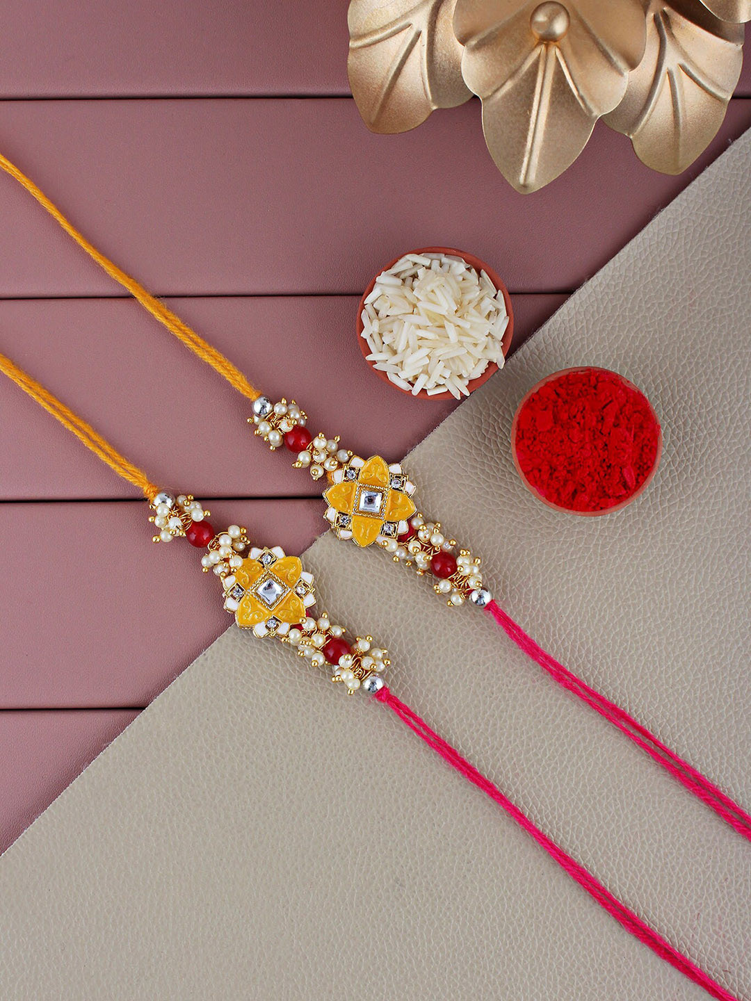 

LUCKY JEWELLERY Men Set Of 2 Gold-Plated Pearl-Studded Meenakari Floral Charm Rakhis