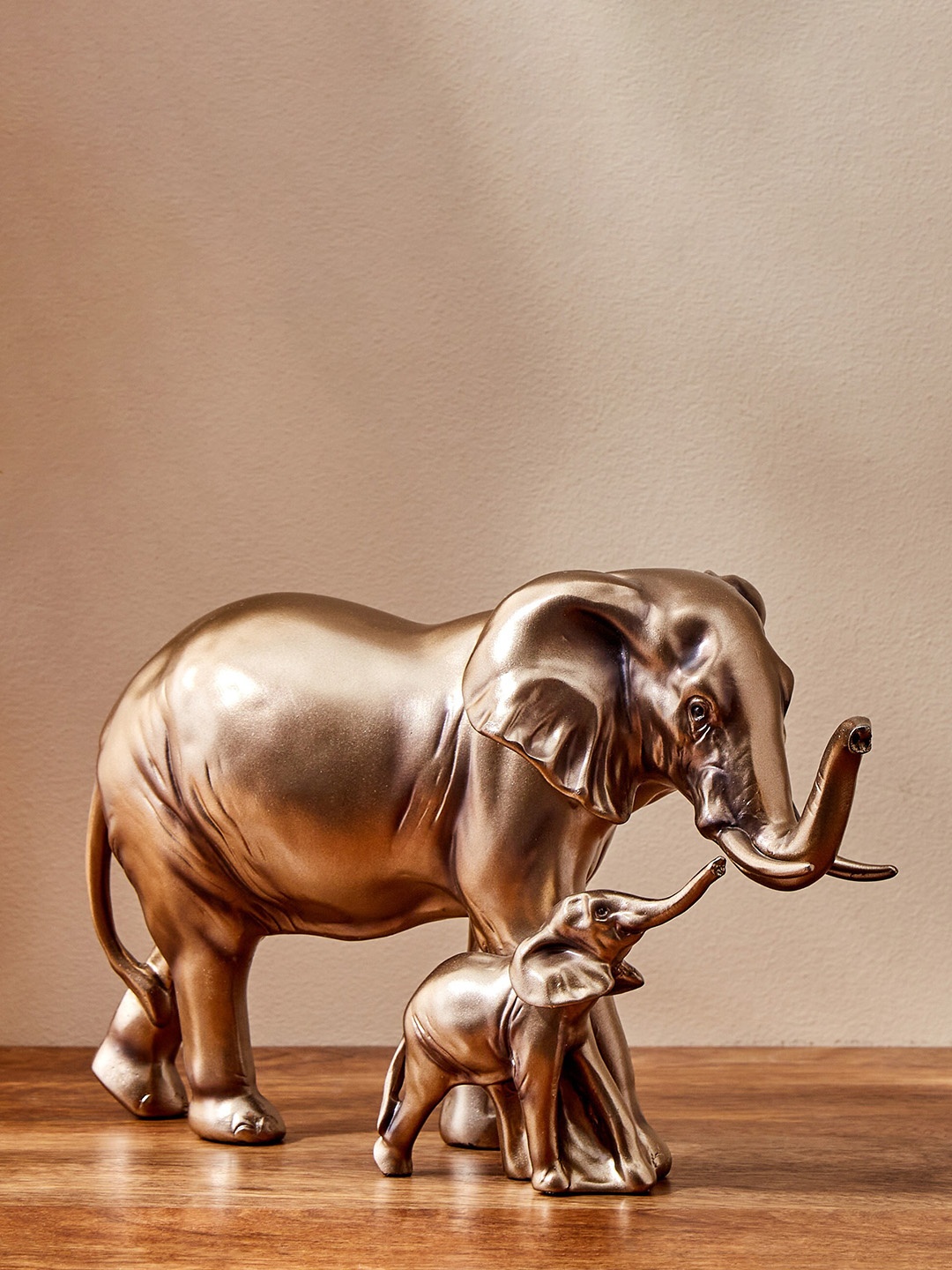 

Home Centre Jaguar Copper-Toned Elephant With Baby Figurine Showpiece