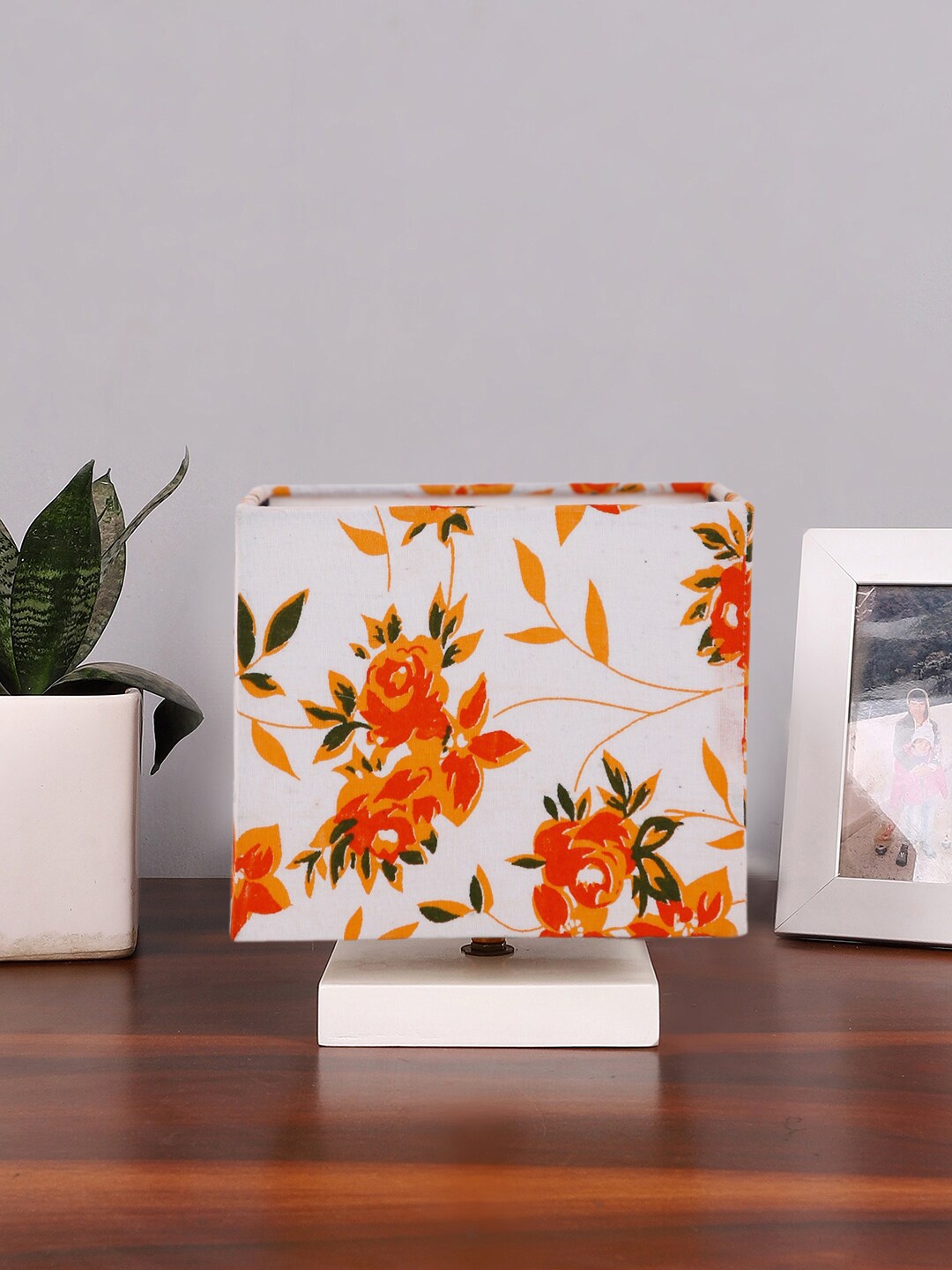 

Devansh White & Orange-Coloured Printed Cotton Table Lamp With Wooden Base