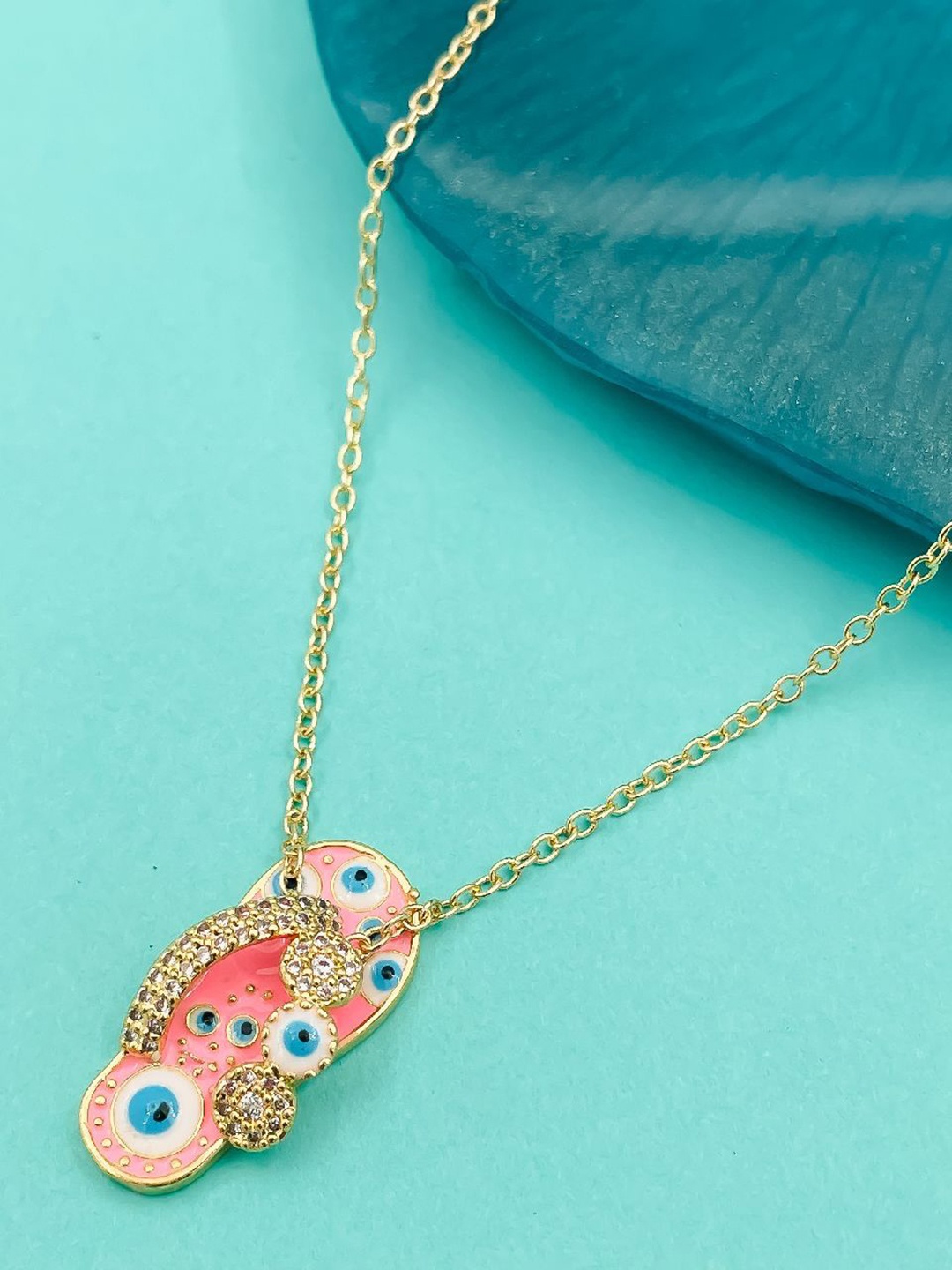 

ZIVOM Gold-Plated Cubic Zirconia Studded Evil Eye Slipper Pendant with Chain