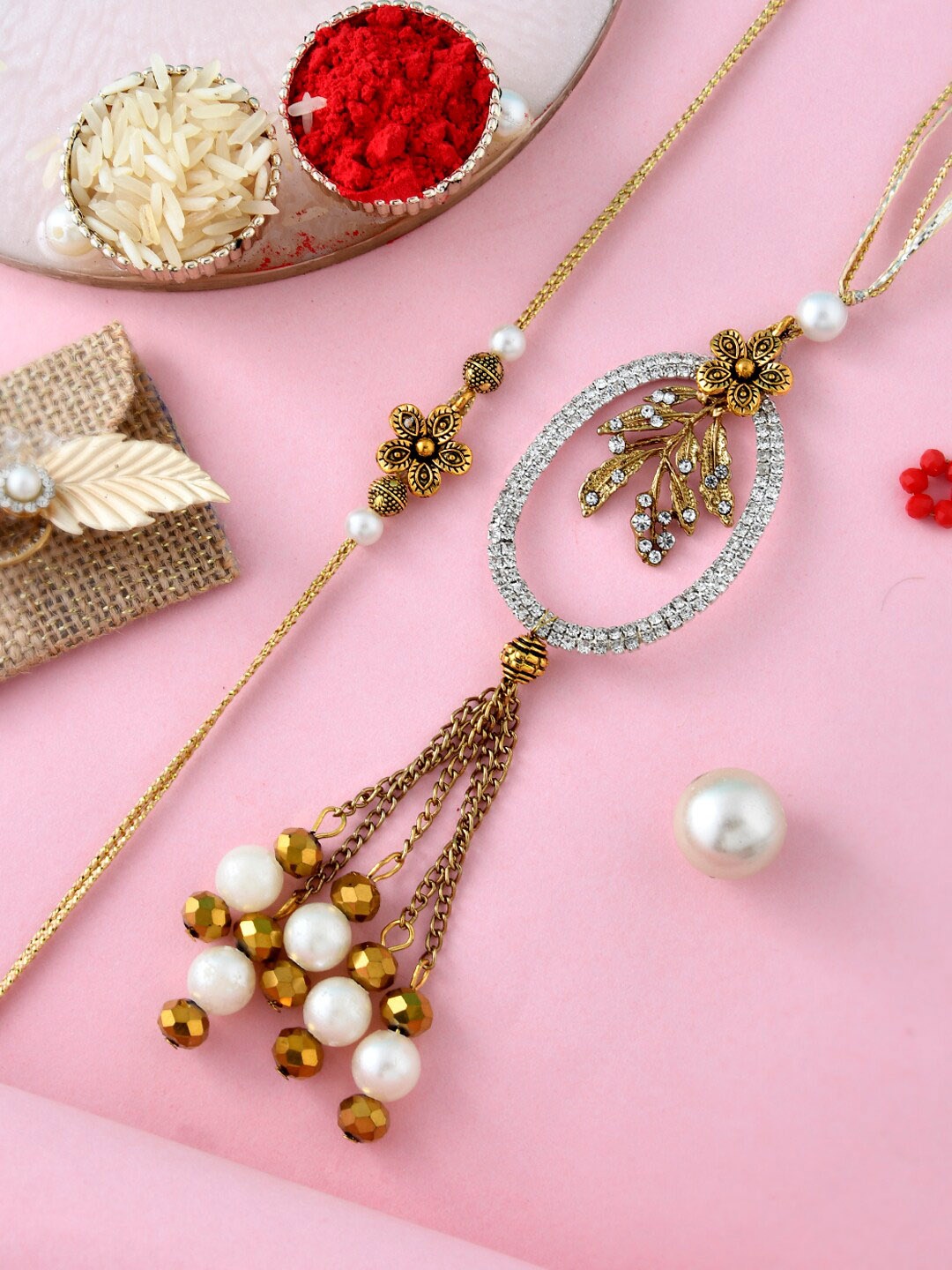 

Aapno Rajasthan Set Of 2 Pearl and Stones Embellished Bhaiya Bhabhi Rakhi, Gold