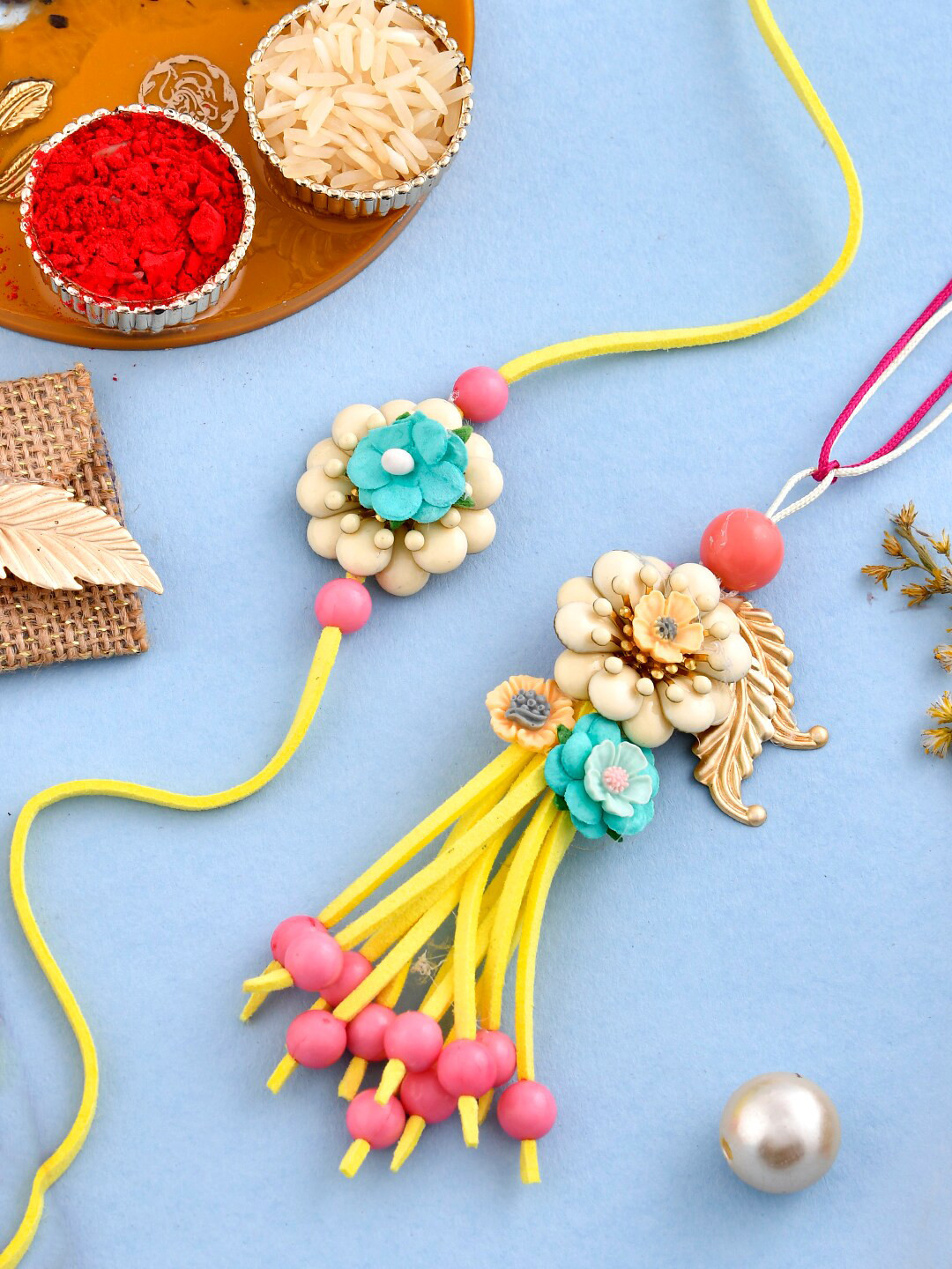 

Aapno Rajasthan Set Of 2 Beaded Bhaiya Bhabhi Rakhi With Roli Chawal & Greeting Card, Beige