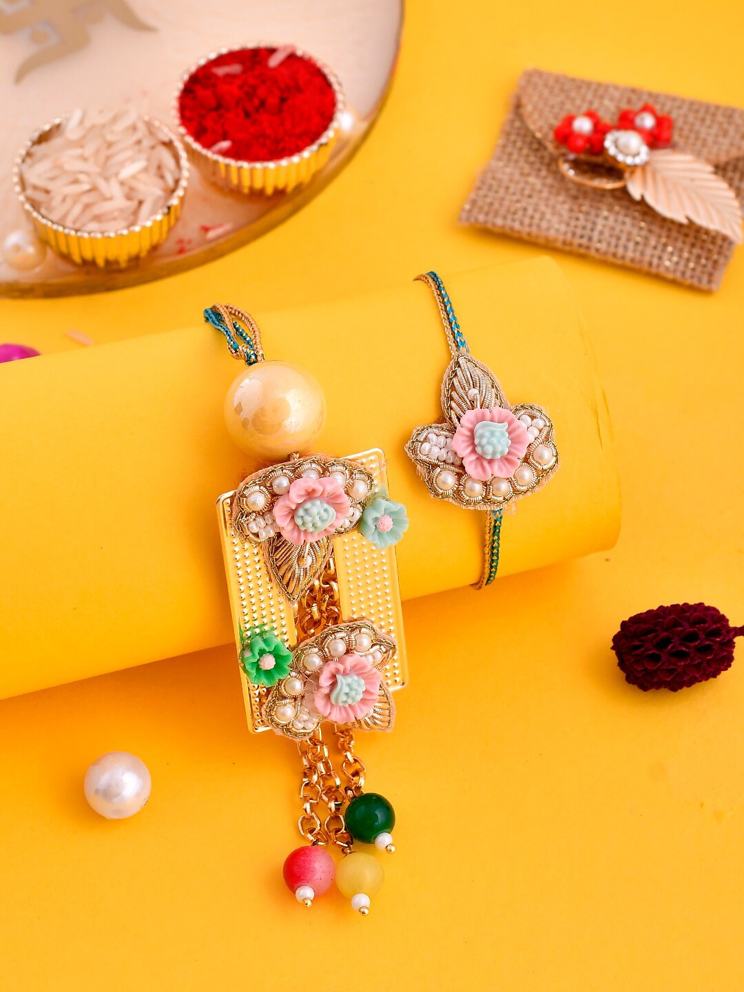 

Aapno Rajasthan Set Of 2 Pearl and Applique Embellished Quirky Bhaiya Bhabhi Rakhi, Gold