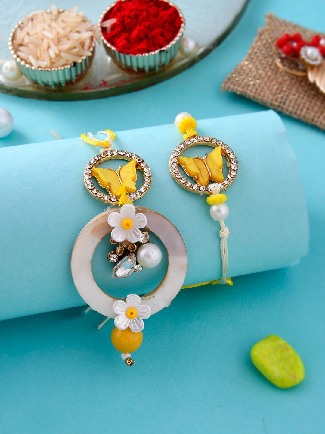

Aapno Rajasthan Unisex Set Of 2 Butterfly & Floral Bhaiya Bhabhi Rakhis, Yellow