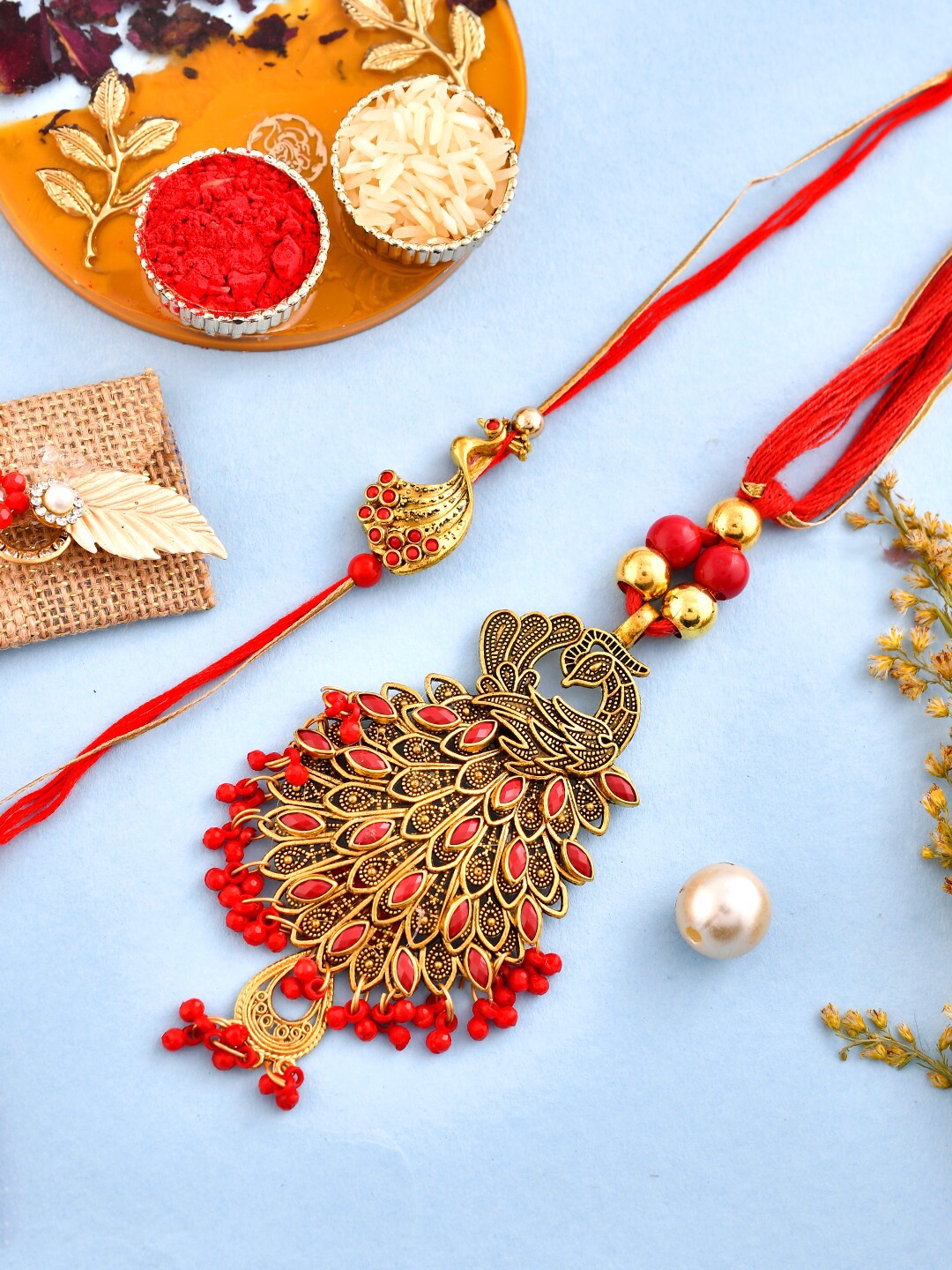 

Aapno Rajasthan Unisex Set Of 2 Peacock Embellished Bhaiya Bhabhi Rakhis, Gold