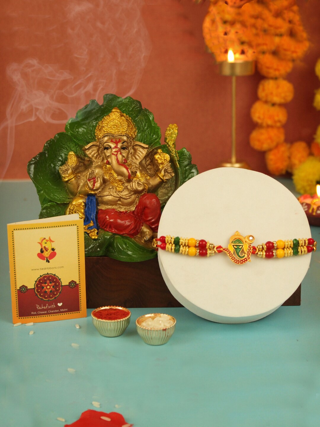 

TIED RIBBONS Unisex Ganesh Rakhi For Brother With Ganesha Idol Combo Gift Set, Beige