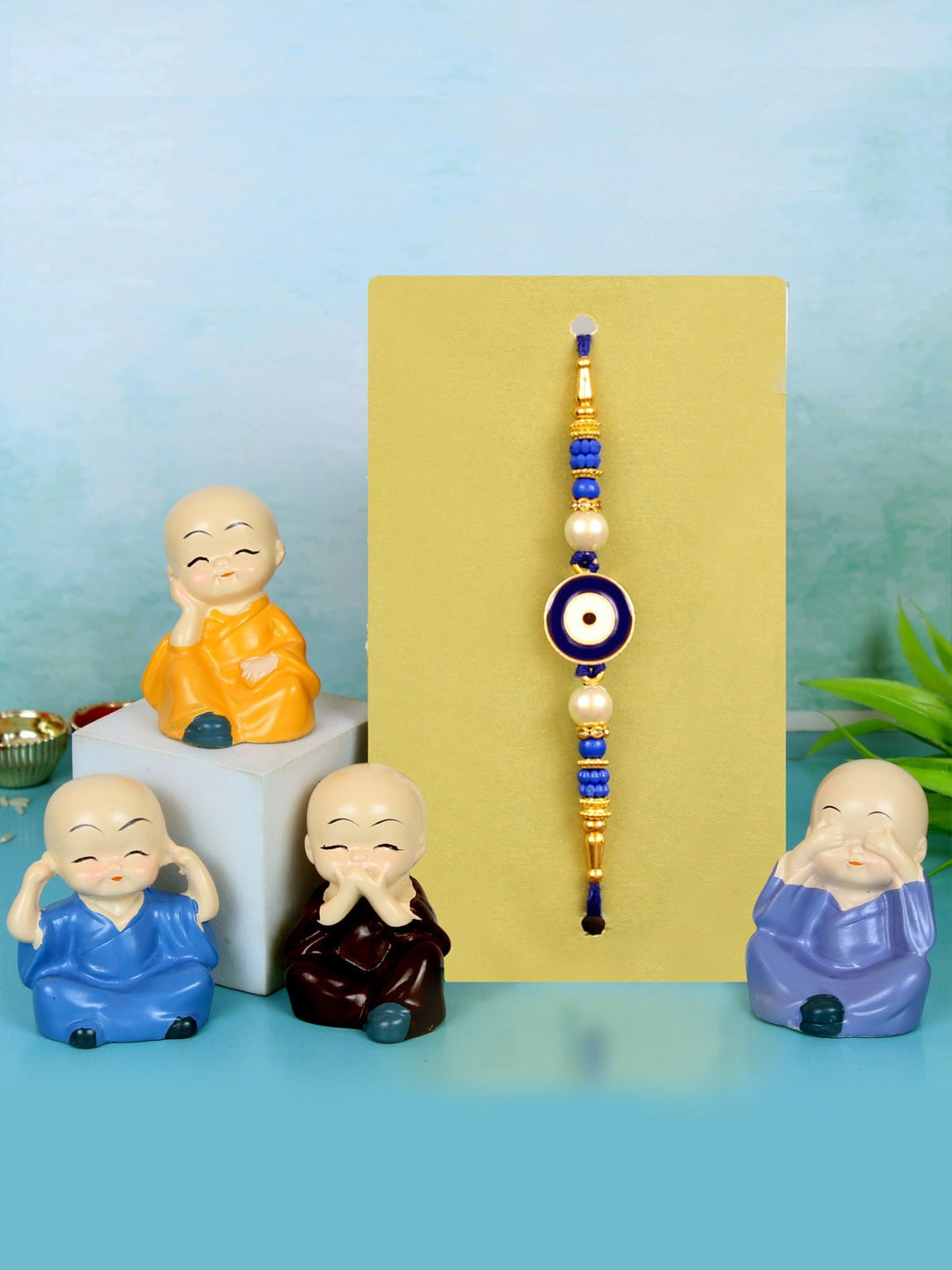 

TIED RIBBONS Men Evil Eye Rakhi With Buddha Monk Idol Gift Set, Blue