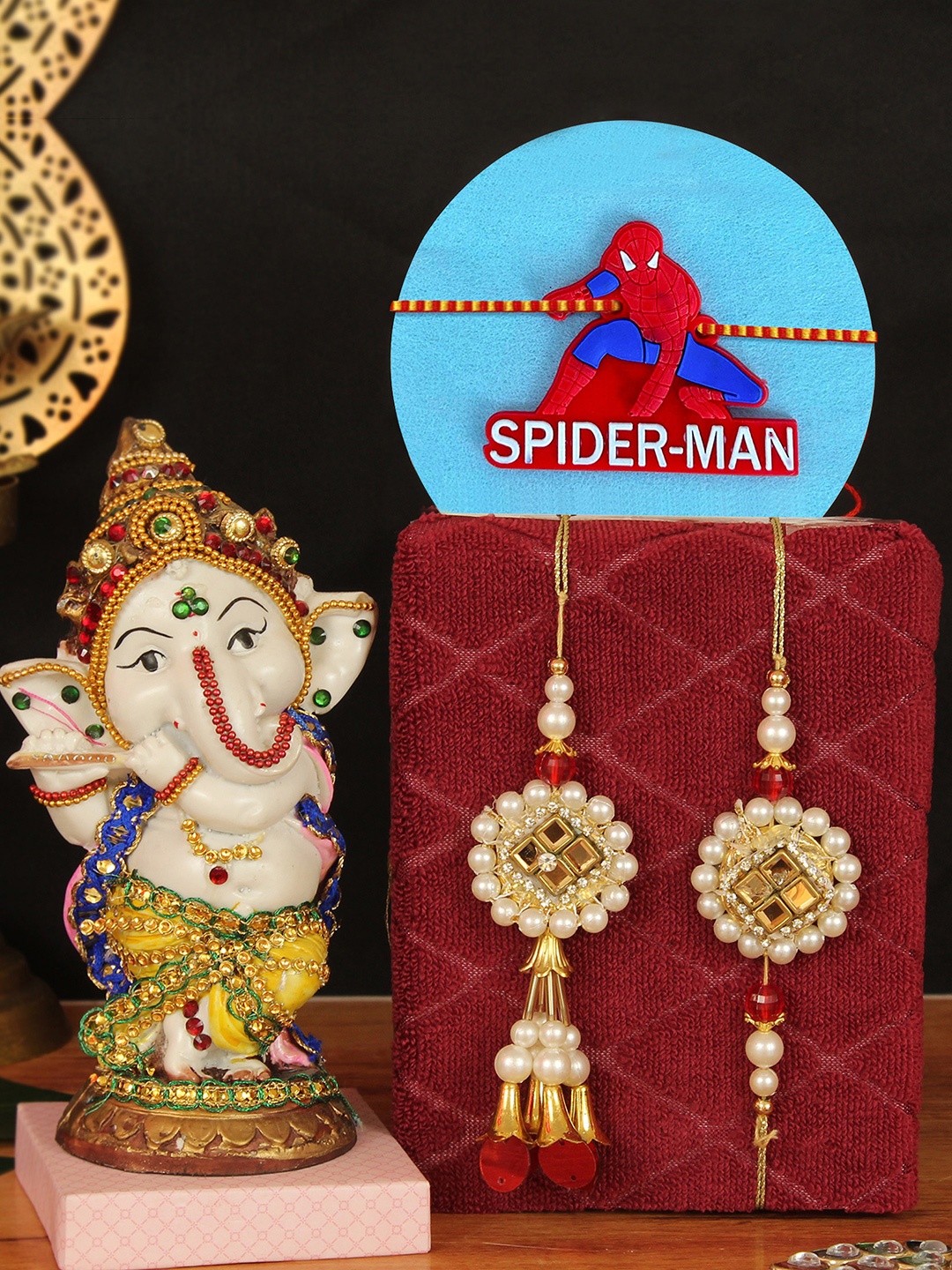 

TIED RIBBONS Set of 3 Bhaiya Bhabhi & Kids Family Rakhi Set With Lord Ganesha Idol, White
