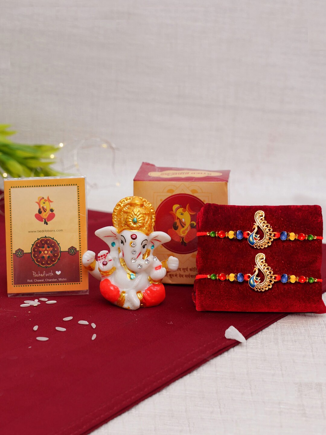 

TIED RIBBONS Set of 2 Designer Rakhi for Brother with Mini Ganesha Idol Gift Set, Red