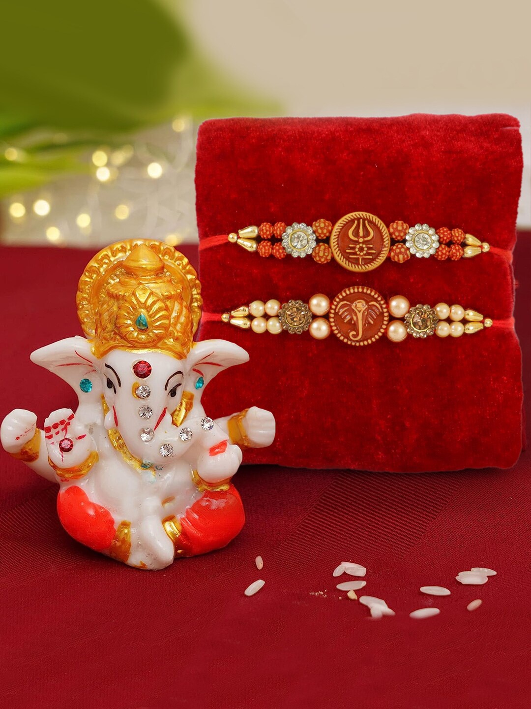 

TIED RIBBONS Set of 2 Rudraksha Rakhi with Mini Lord Ganesha Idol, Red