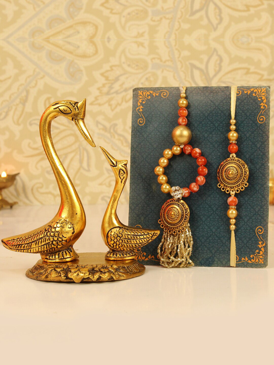 

TIED RIBBONS Set of 2 Bhaiya Bhabhi Lumba Rakhi Gift Set with Swan Statue, Red