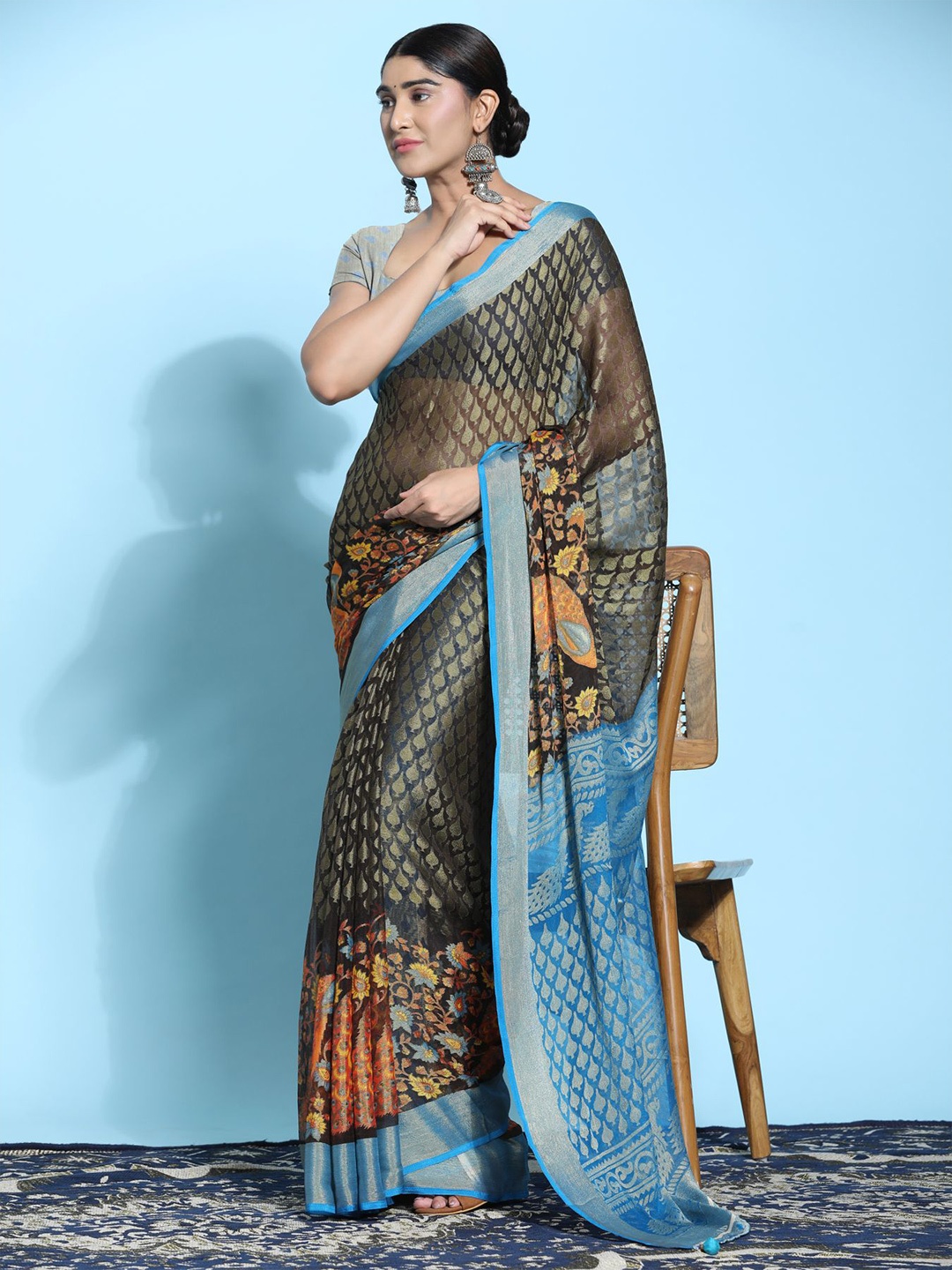 

Phenav Ethnic Motifs Printed Zari Brasso Patola Saree, Brown