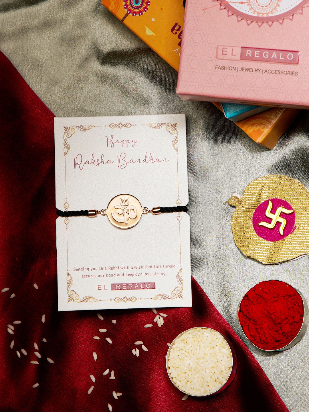 

EL REGALO Bhai Om Charm Details Stainless Steel Rust Free Rakhi With Roli Chawal, Rose gold