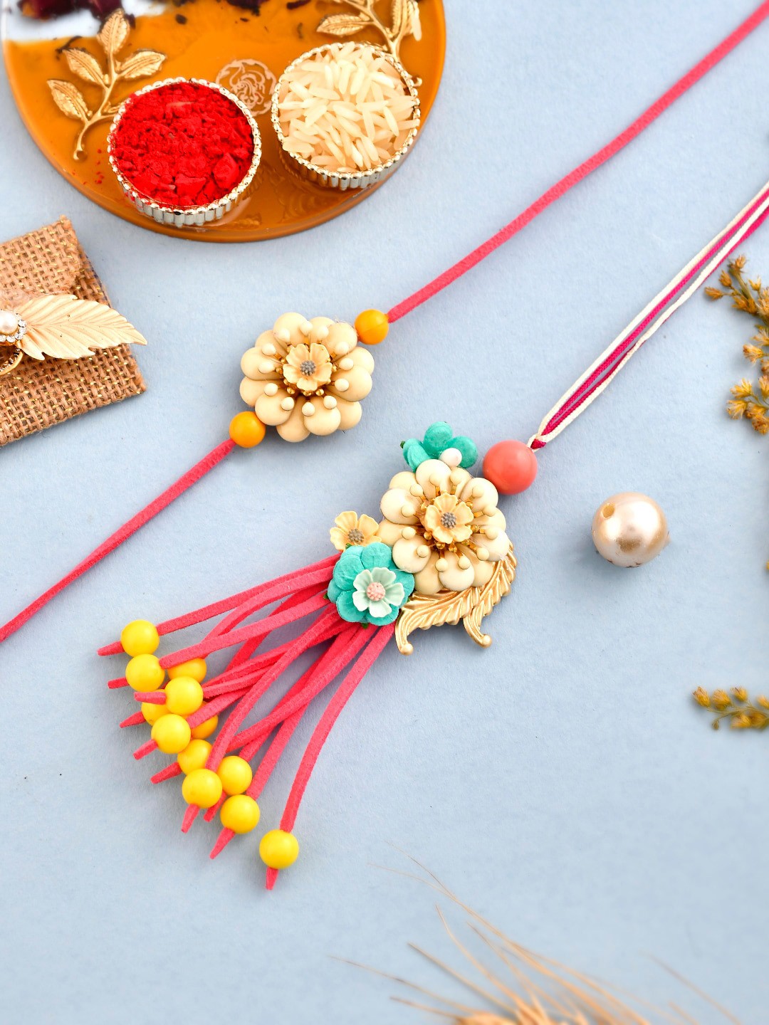 

Aapno Rajasthan Set Of 2 Flower shaped Traditional Rakhis With Roli Chawal & Box, Gold