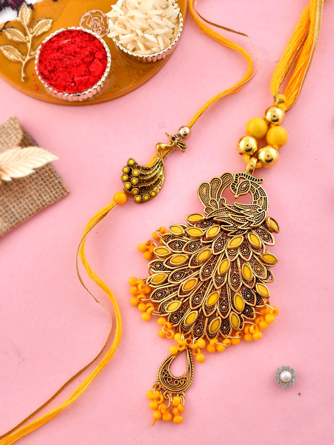 

Aapno Rajasthan Set of 2 Stone-Studded & Beaded Rakhis With Roli,Chawal & Card, Yellow